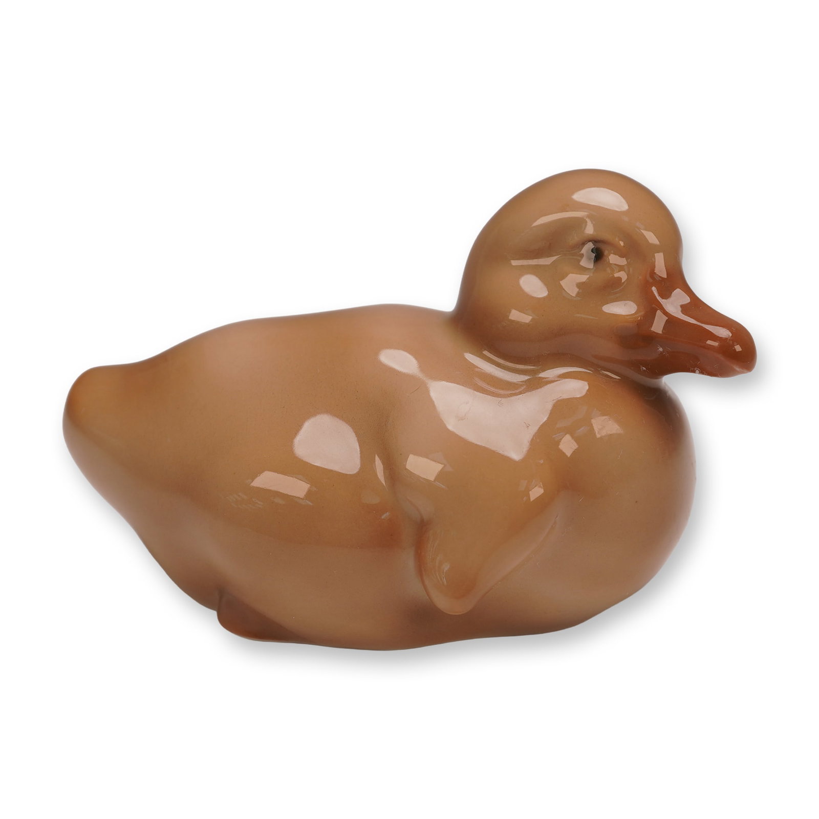 Bing & Grondahl Porcelain Duckling Figurine, 1548: This charming porcelain duckling figurine was crafted by Bing & Grondahl of Denmark, known for their exceptional quality and artistry. Finished in a warm brown glaze, the piece captures the gentle,