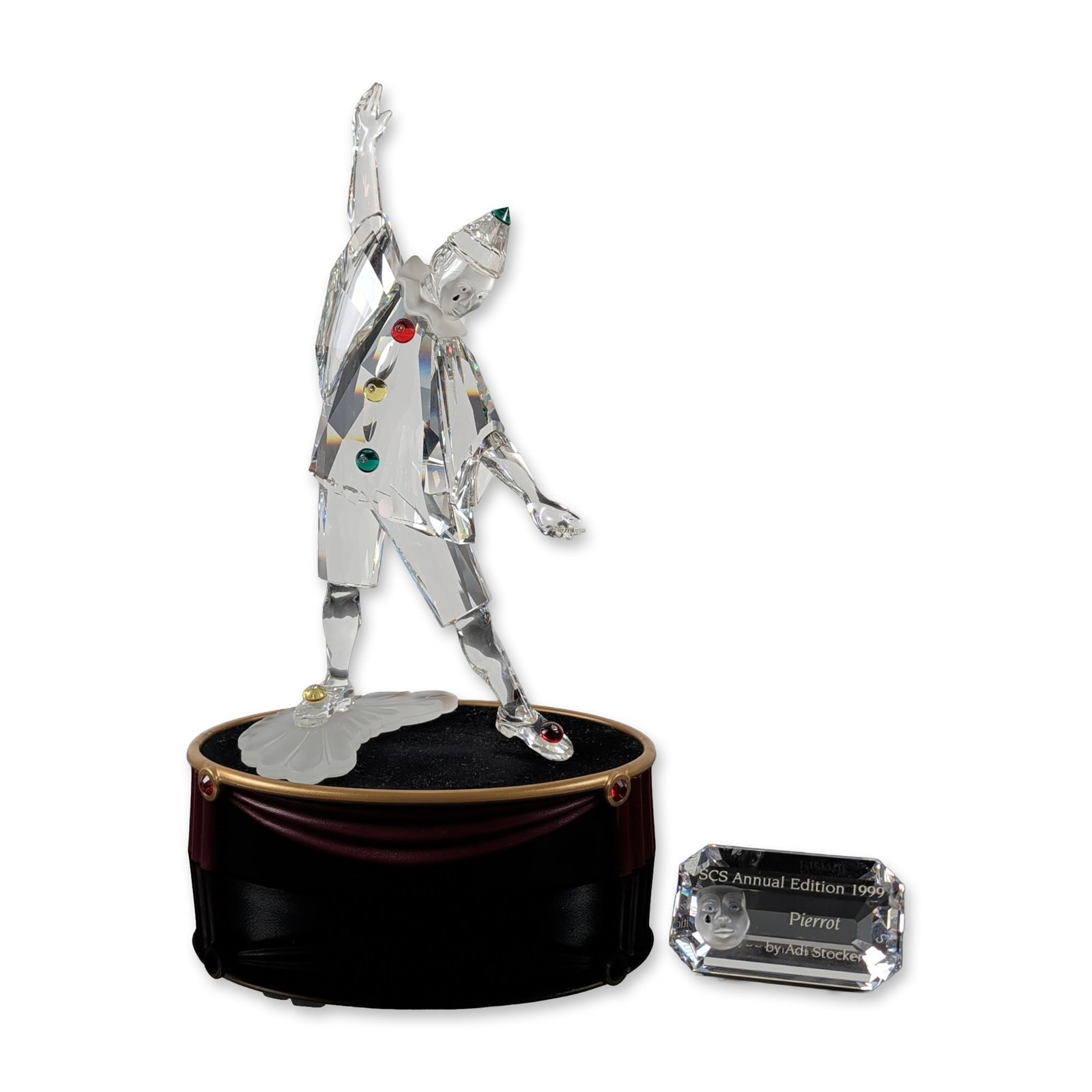 Swarovski 1999 SCS Pierrot Crystal Figurine with Title Plaque and Base: Swarovski Crystal Society (SCS) 1999 annual edition figurine titled Pierrot, designed by Adi Stocker. This piece represents the first entry in the Masquerade trilogy. The figure is composed of