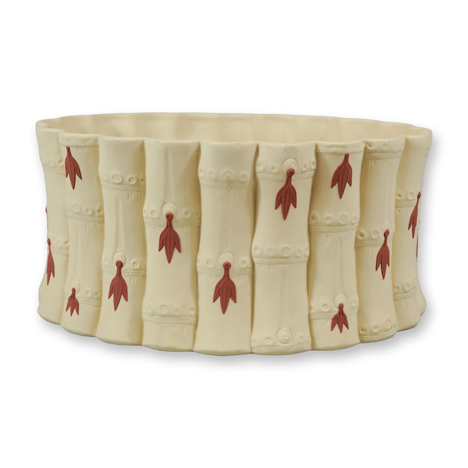 Wedgwood Caneware Primrose and Terracotta Bamboo-Form Oval Cachepot: A Wedgwood caneware oval cachepot or planter molded in a realistic bamboo-stalk motif. The fine-grained, primrose-colored unglazed stoneware body features a scalloped rim and base that follow the vert