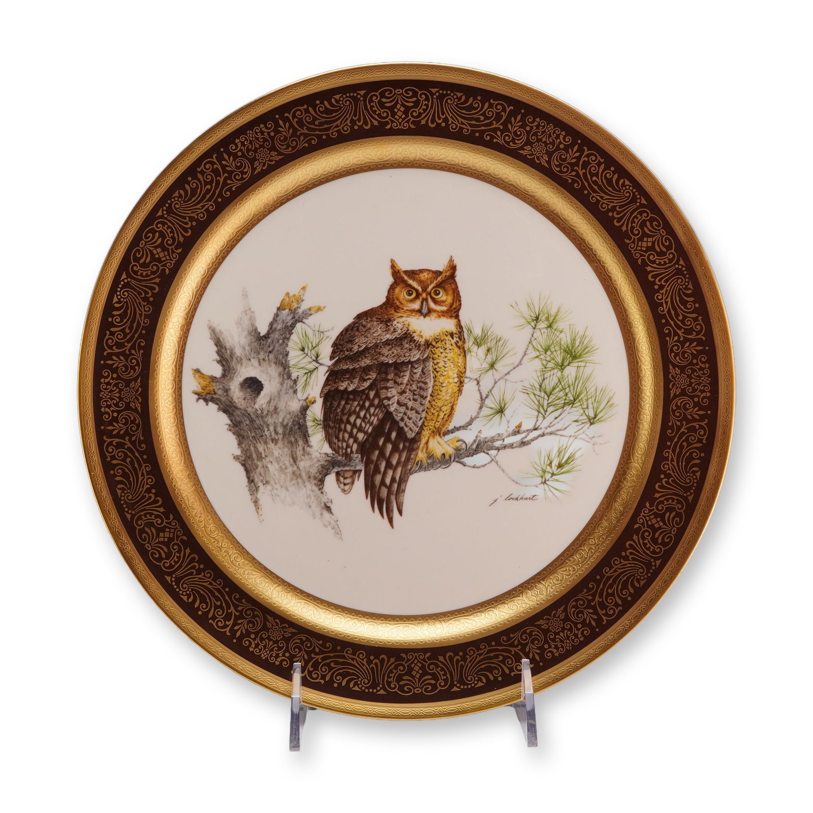 Pickard China Limited Edition Great Horned Owl Porcelain Plate by James L. Lockhart: A circular porcelain collector plate manufactured by Pickard China. The central well features a transfer-printed image of a Great Horned Owl perched on a pine branch next to a weathered tree trunk, ta