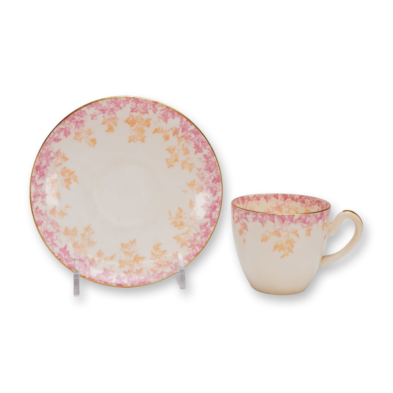 Wileman & Co Foley China Cup and Saucer Set 5412: The set is crafted from glazed ceramic china with a creamy white ground. The decoration features an all-over transfer pattern of stylized ivy or vine leaves rendered primarily in alternating shades