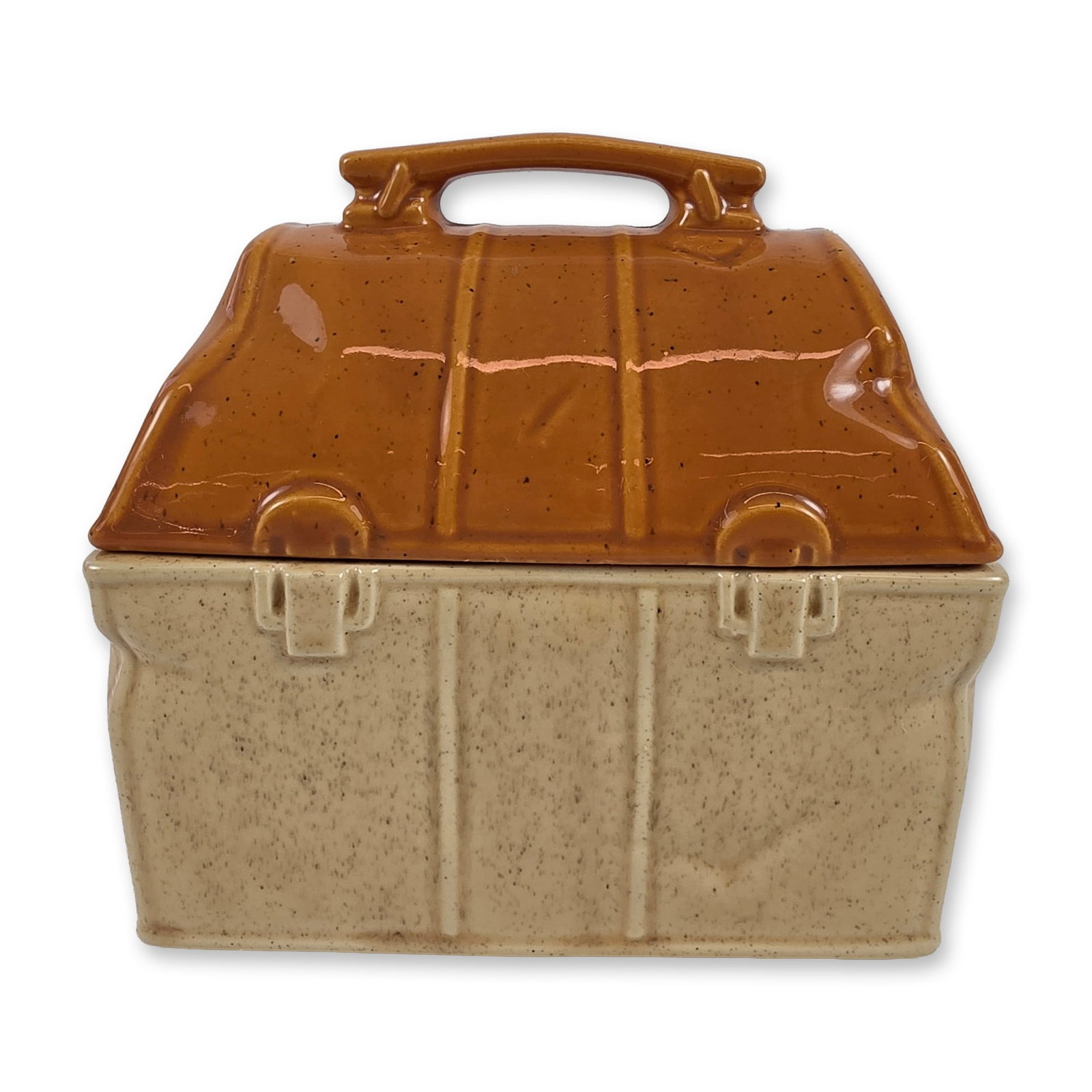 McCoy Pottery Ceramic Lunch Box Cookie Jar: McCoy Pottery (American, 20th century). Ceramic lidded cookie jar in the form of a lunch box or satchel, finished in a two-tone speckled glaze. Features molded buckle and strap details with a fixed