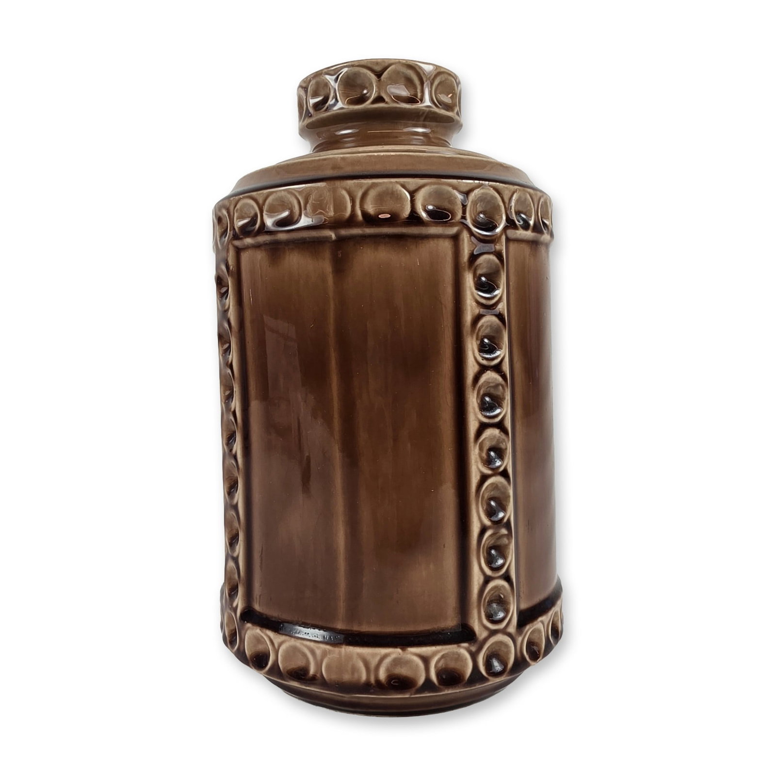 McCoy Brown Glazed Thumbprint Canister: McCoy Pottery lidded canister in dark brown glazed earthenware, featuring a molded thumbprint or beaded relief pattern with vertical ribbing. The matching circular lid is designed with a recessed gall