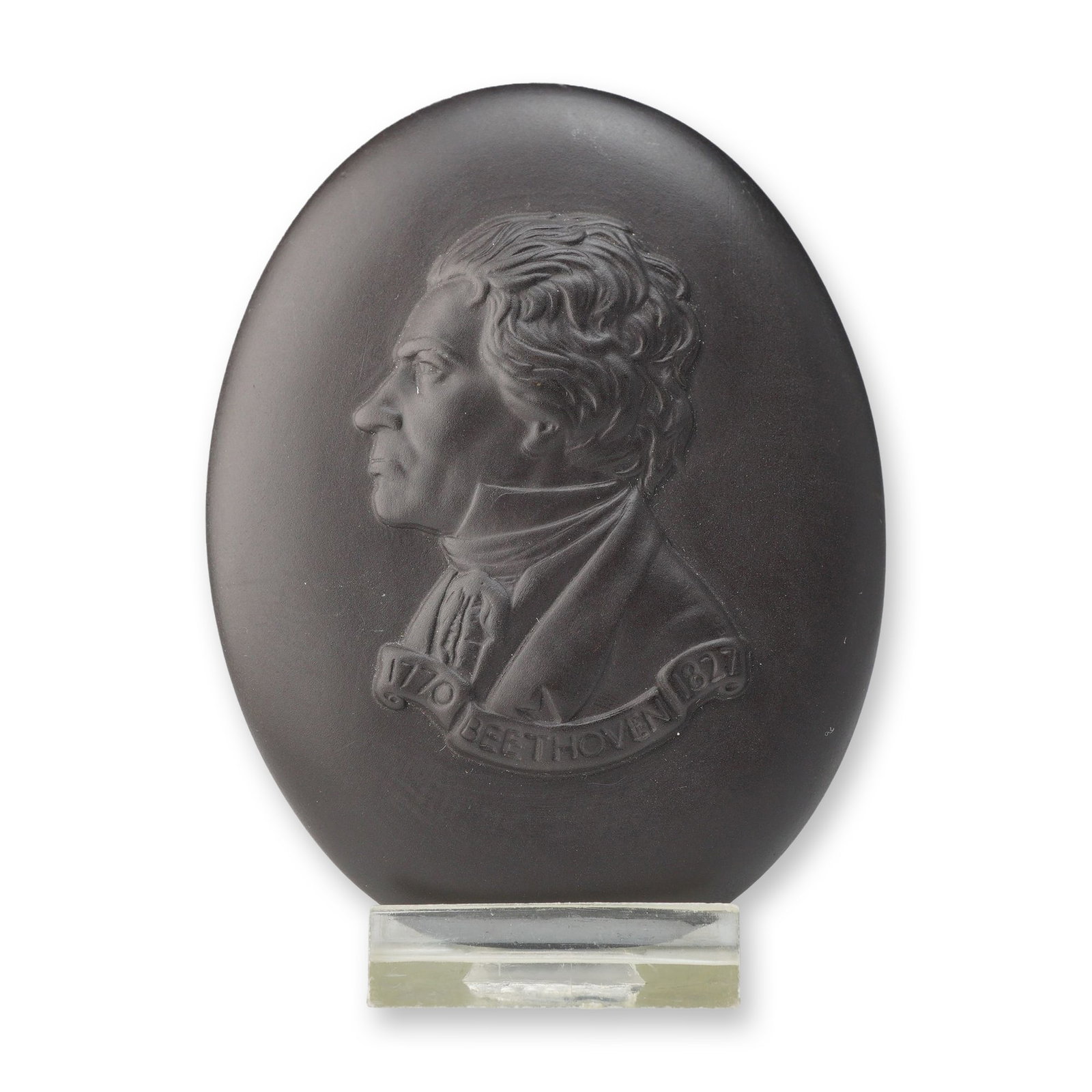 Wedgwood Black Basalt Ludwig van Beethoven Portrait Medallion: A Wedgwood black basalt stoneware oval medallion featuring a bas-relief portrait of composer Ludwig van Beethoven in profile facing left. The composer is depicted with his characteristic wild hair