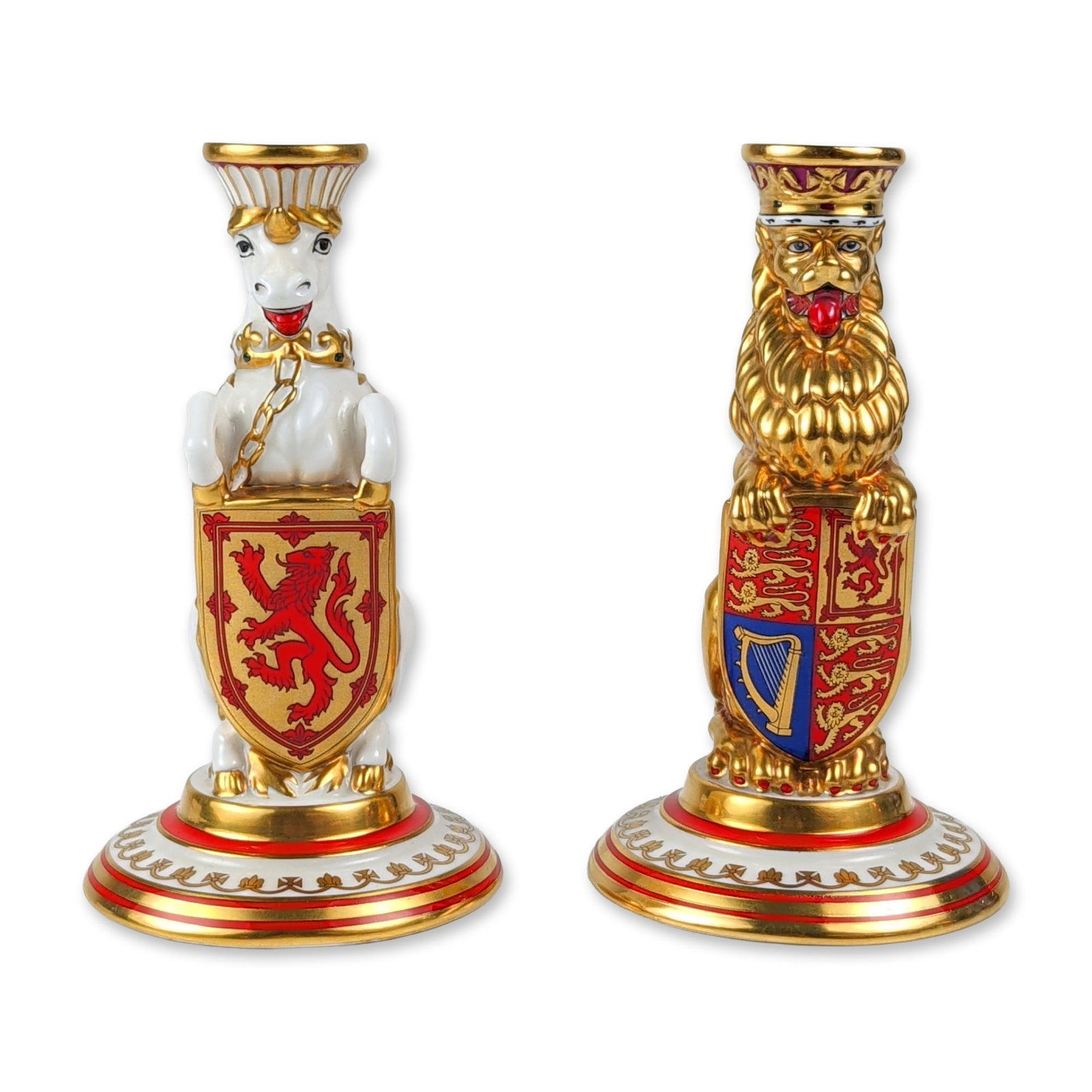 Pair of Minton Silver Jubilee Queen's Beasts Candlestick: Minton bone china heraldic beast candlesticks produced in 1977 to commemorate the Silver Jubilee of Queen Elizabeth II. The set features two figures representing the Queen's Beasts: a sejant lion hold