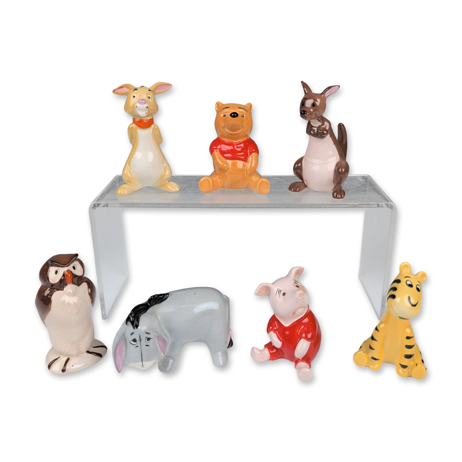 7pc Beswick England Disney Winnie the Pooh Figurines: Beswick, England. Set of seven figurines in polychrome glazed porcelain, featuring characters from the Disney Winnie the Pooh series. The group includes Winnie-the-Pooh, Tigger, Piglet, Eeyore, Kanga,