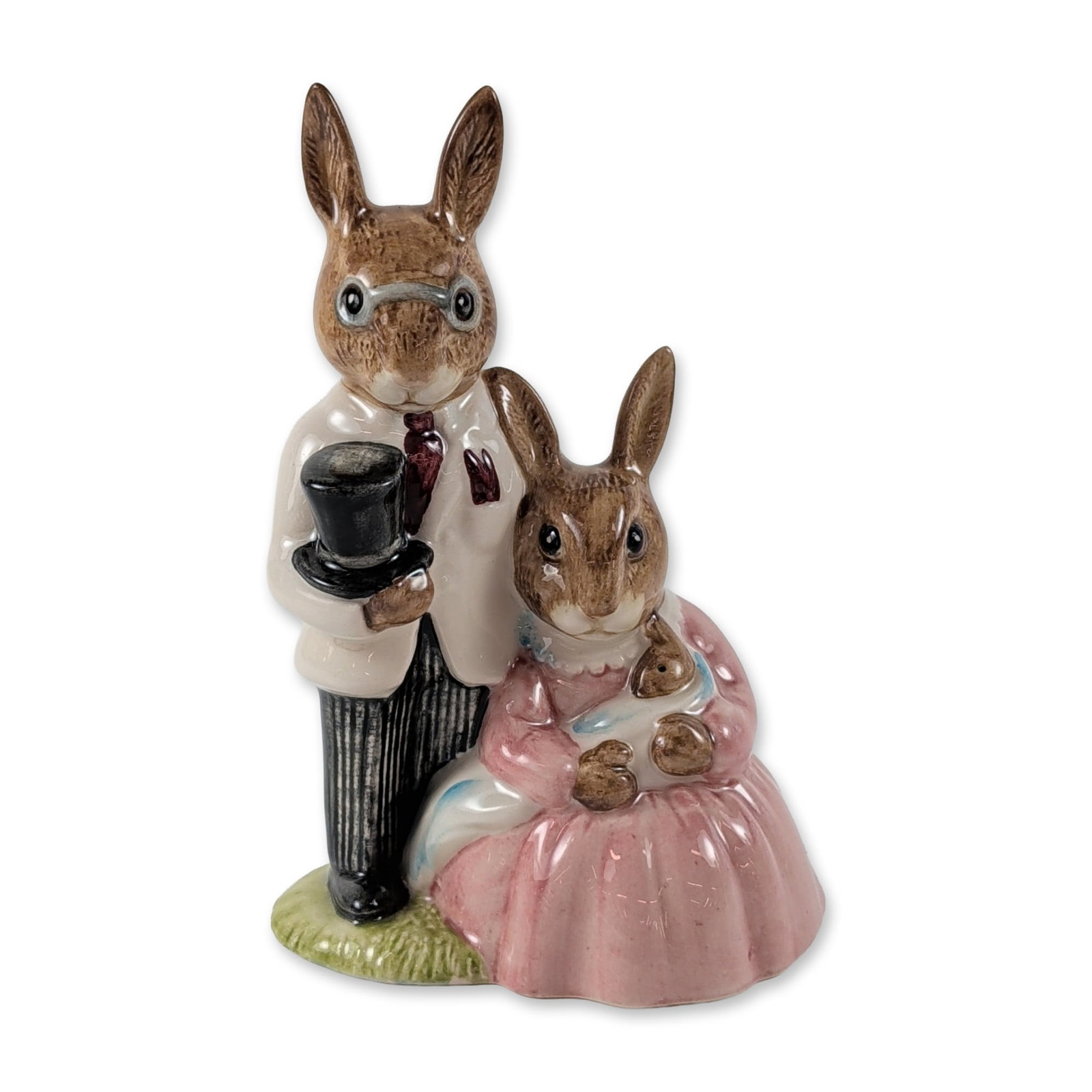 Royal Doulton Bunnykins Family Photograph Figurine: Royal Doulton. Bunnykins glazed porcelain figurine titled Family Photograph, model number DB 67. The anthropomorphic figures are depicted in formal wear, featuring a male rabbit in a white coat and sp