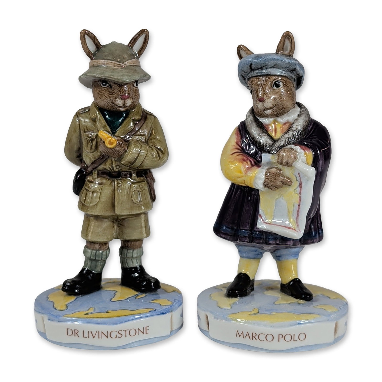 Royal Doulton Explorers Bunnykins Figurines: Royal Doulton. Pair of limited edition glazed porcelain Bunnykins figurines from the Explorers series. One figure depicts Marco Polo (DB 414) in medieval attire holding a scroll, and the other depicts