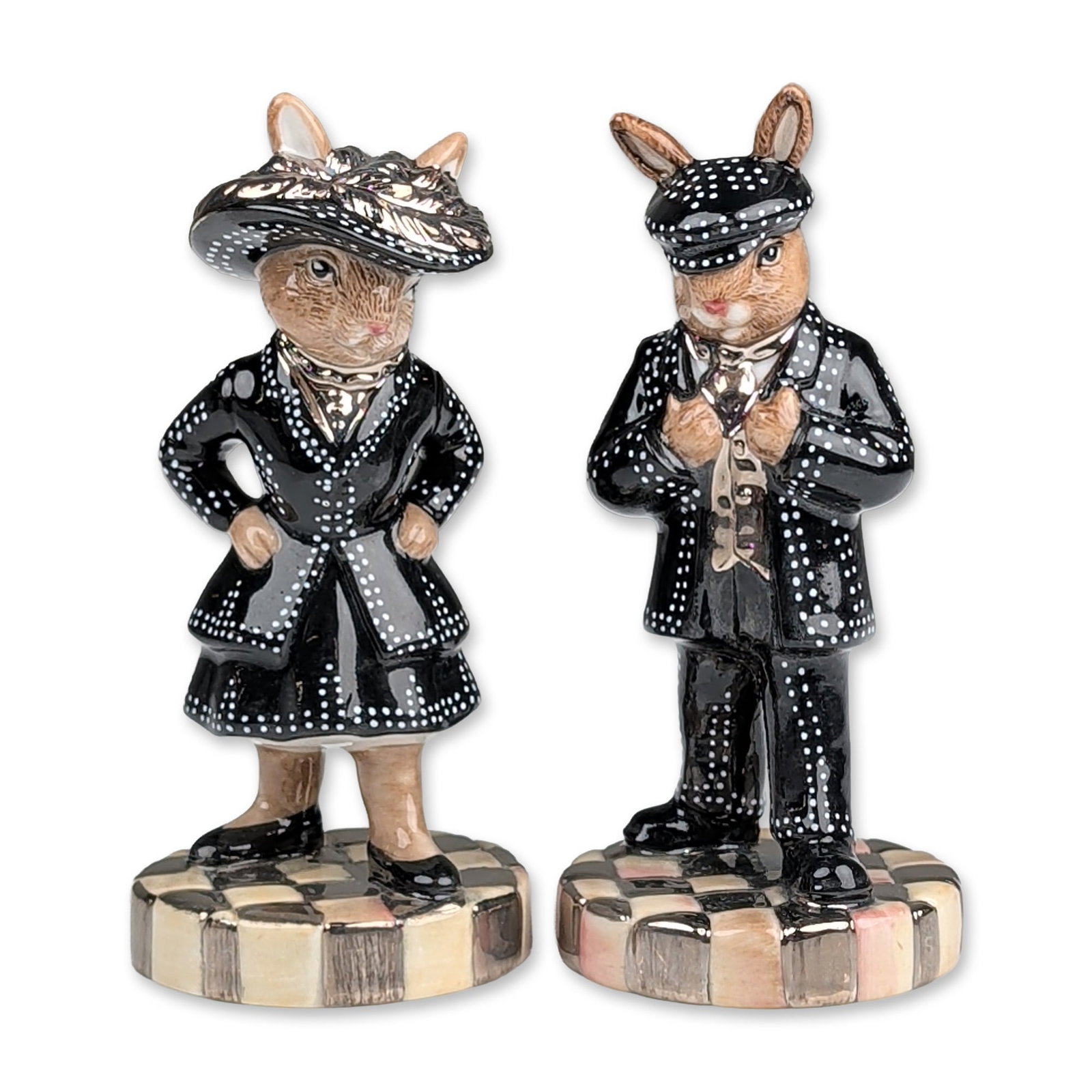 2pc Royal Doulton Bunnykins Gold Pearly King and Queen Figurines: Royal Doulton Bunnykins glazed ceramic figurines, Pearly King and Pearly Queen models DB 411 and DB 412. The figures depict rabbits in traditional London Pearly dress, featuring black attire detailed 