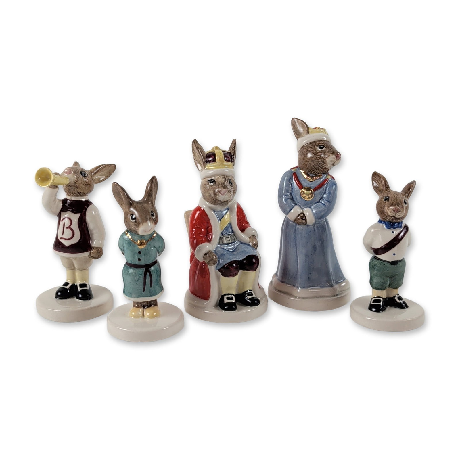 5pc Royal Doulton Bunnykins Royal Family Figurines: Royal Doulton, England. Group of five figurines from the Bunnykins Royal Family series, crafted in hand-painted glazed ceramic. The collection features King John, Queen Sophie, Princess Beatrice, Prin
