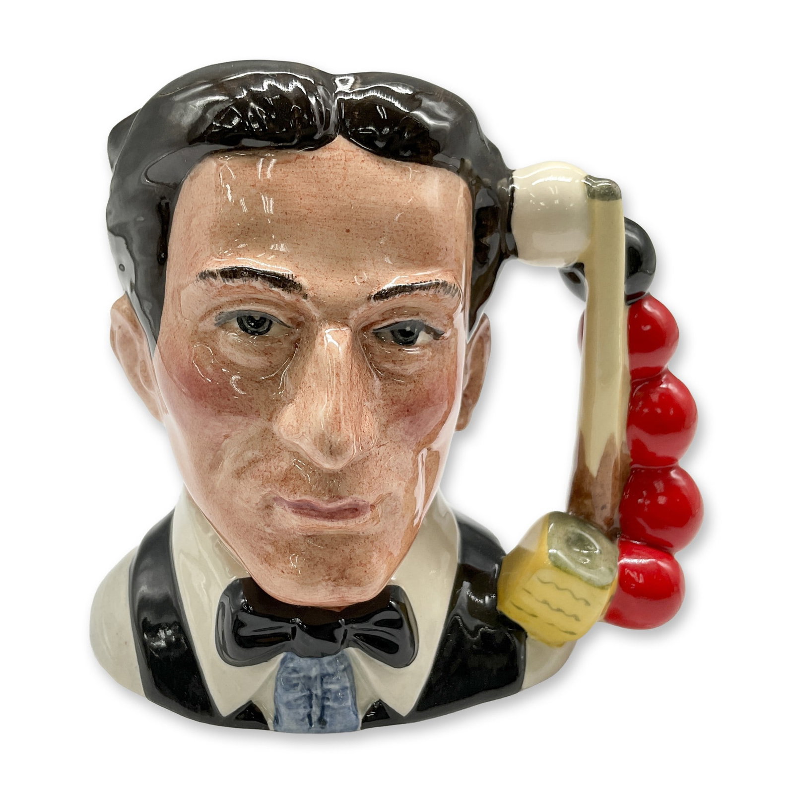 Snooker Player D6879 - Small - Royal Doulton Character Jug: Black hair; white shirt; black bow tie and vest. Royal Doulton backstamp. Artist: Stanley J. Taylor Dimensions: 4"H Date or Era: 1991 - 1995 Manufacturer or Brand: Royal Doulton Country of Origin: