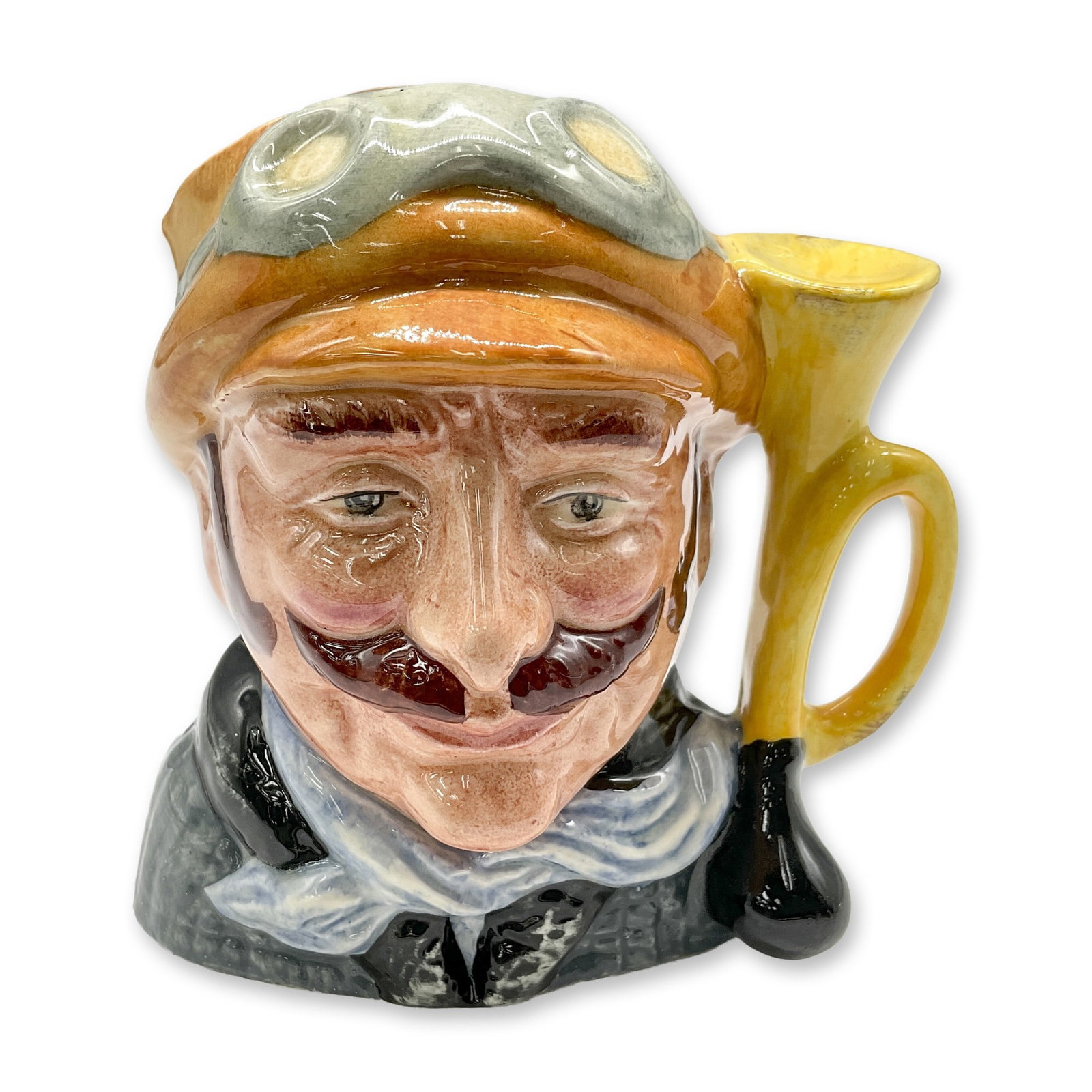 Veteran Motorist D6637 - Small - Royal Doulton Character Jug: Yellow hat; green coat; white scarf. Royal Doulton backstamp. Artist: David B. Biggs Dimensions: 3.25"H Date or Era: 1973 - 1983 Manufacturer or Brand: Royal Doulton Country of Origin: Englan