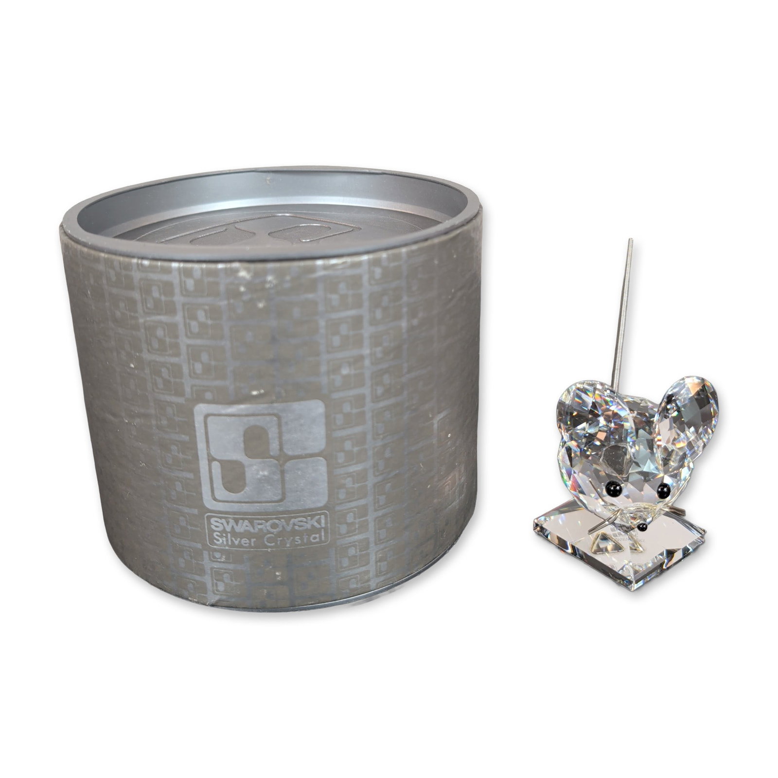 Swarovski Silver Crystal Figurine, Medium Mouse: The figure features large circular faceted ears, two black bead eyes, and a flexible coiled metal tail. The base is etched with the Swarovski swan logo and brand name. Accompanied by the original
