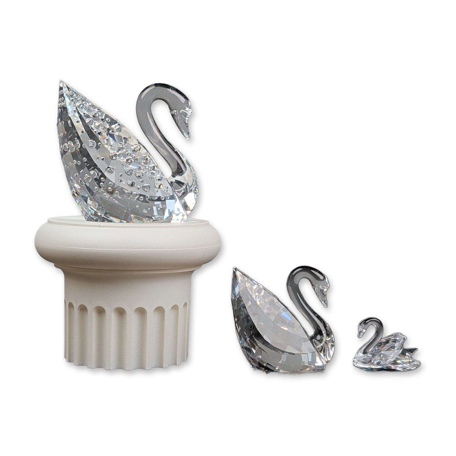 4pc Swarovski Crystal Swan Figurines with Base: Swarovski faceted lead crystal swan figurines, including the Centenary commemorative edition. The large Centenary swan was designed by Anton Hirzinger for the 100th anniversary (1895-1995) and