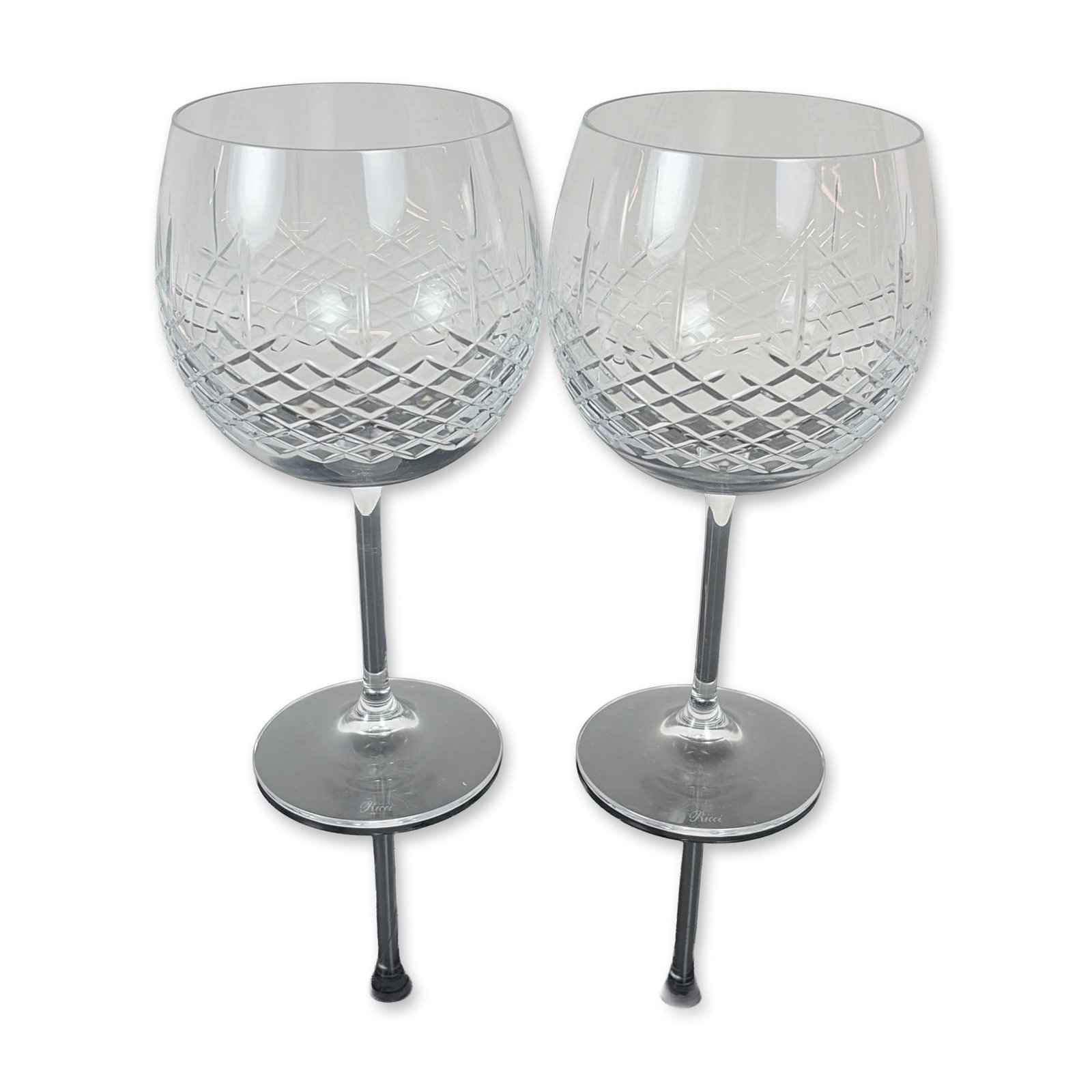 Pair of Ricci Cut Crystal Balloon Wine Glasses: Set of Ricci Argentieri cut crystal wine glasses. Each glass features a globular bowl decorated with a precision diamond cut pattern to the lower half, transitioning to a clear upper section. The bowl