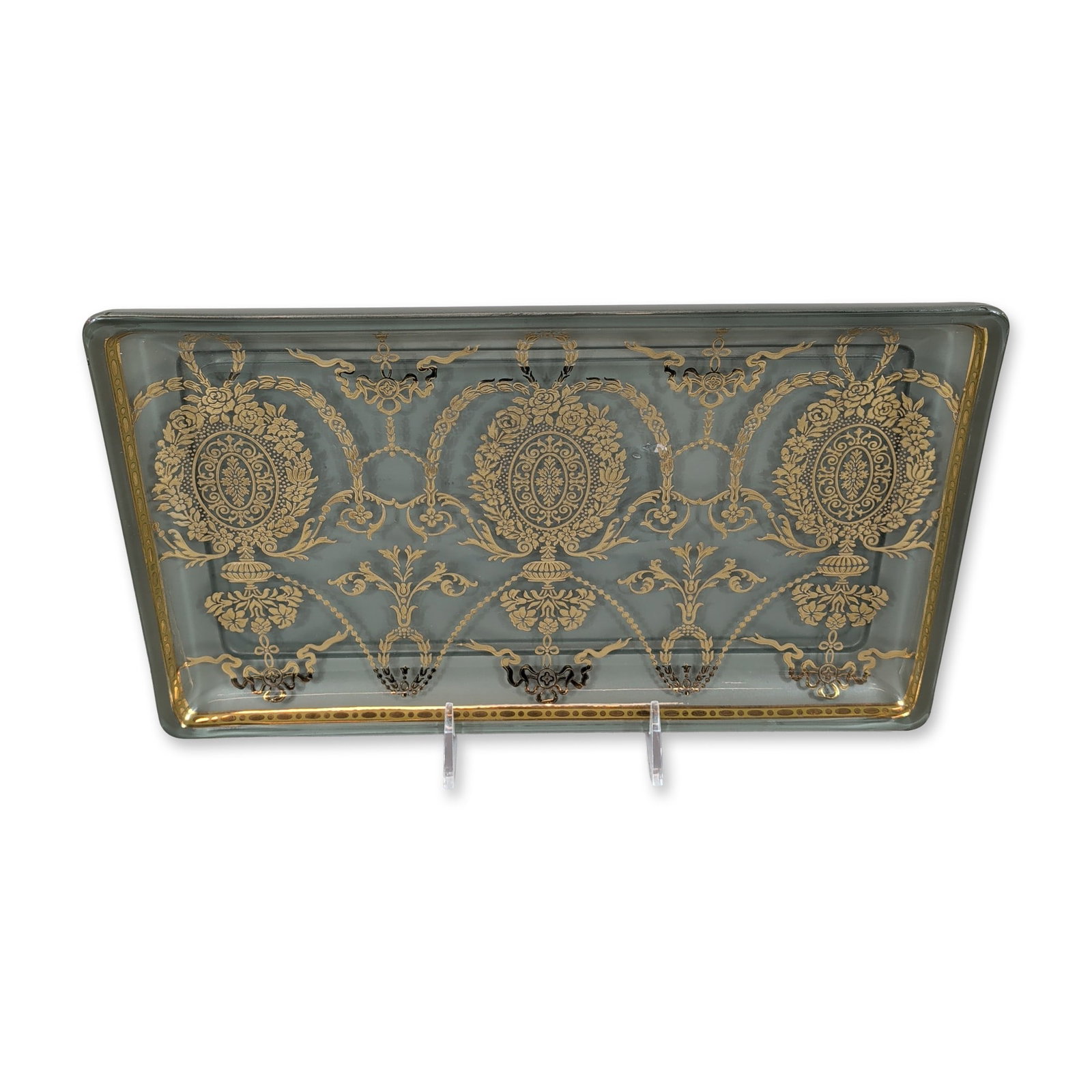 Dominis Reverse Painted Glass Tray: Dominis reverse painted glass serving tray featuring neoclassical decoration. The rectangular tray is finished in a pale blue color on the reverse and decorated with gold-tone neoclassical motifs incl