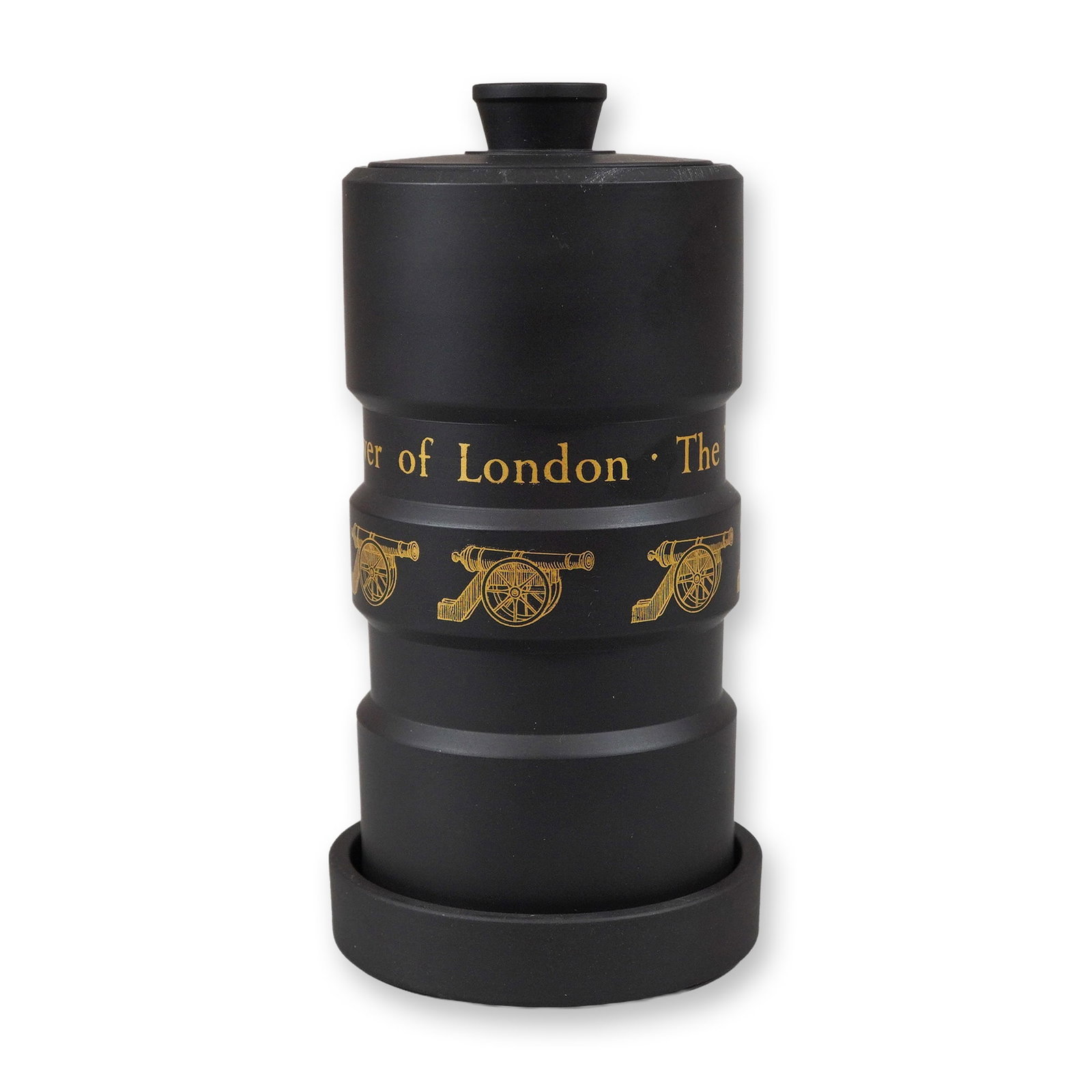 Wedgwood Black Basalt Tower of London Commemorative Lidded Jar and Coaster: This three-piece commemorative set consists of a lidded jar and matching circular coaster, produced by Wedgwood in black basalt, an unglazed matte black stoneware. The cylindrical body of the jar is d