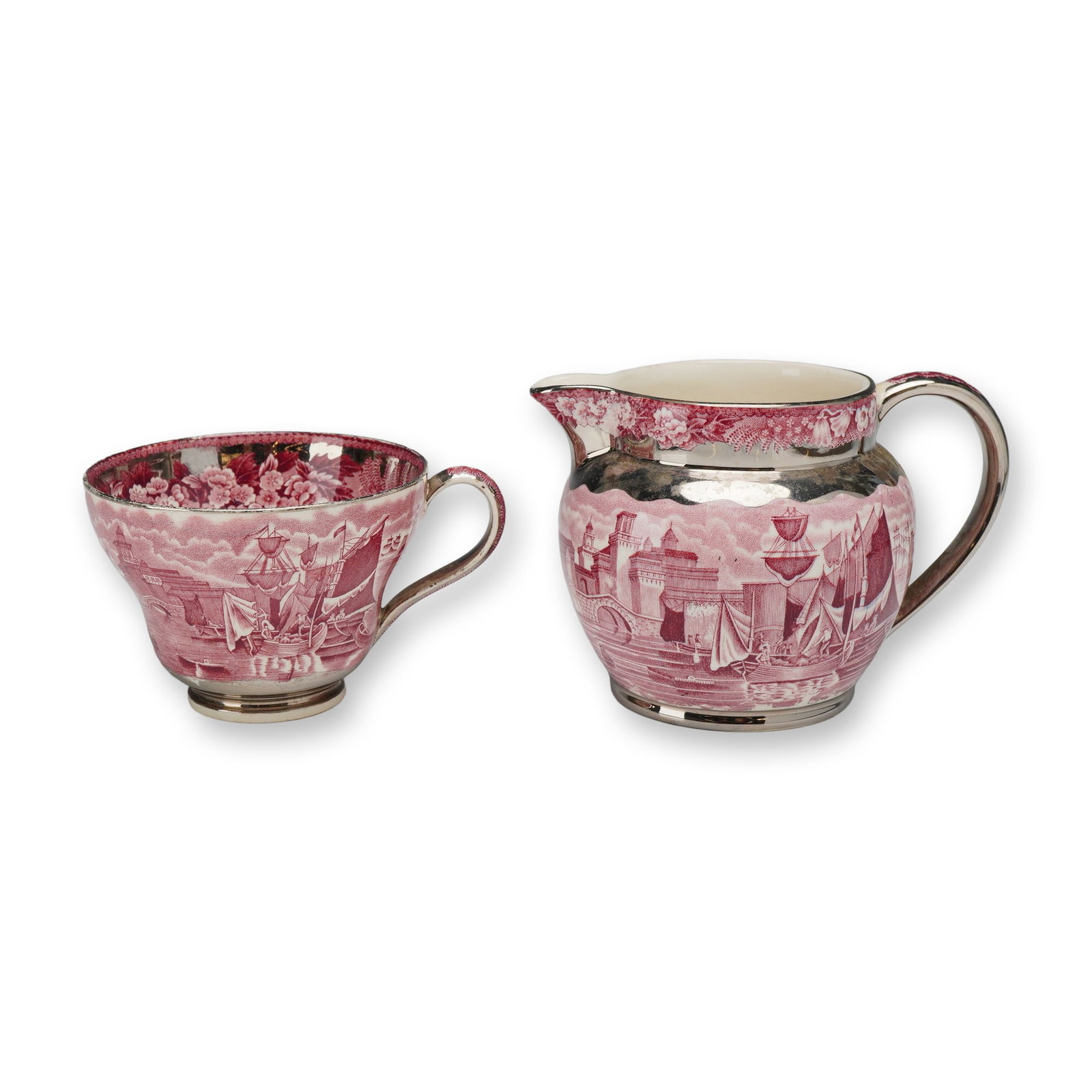 Two-Piece Wedgwood & Barlaston Ferrara Pink Transferware Set, Cup and Creamer Jug: The set is made of earthenware with a pink transfer-printed design. The decoration features a detailed maritime scene with multiple-masted sailing ships in a harbor adjacent to fortified, castle-like 