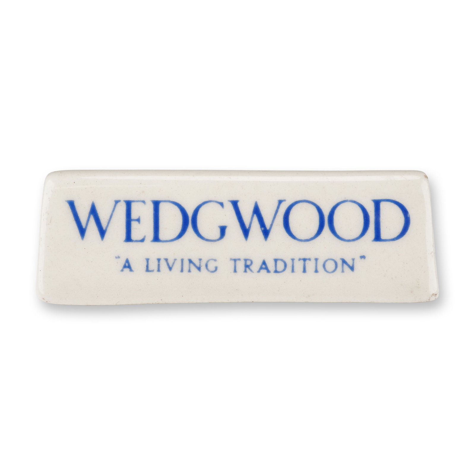 Wedgwood Porcelain Retailer Shop Display Plaque: A Wedgwood porcelain retailer shop display or point-of-sale plaque. The piece is crafted from glazed white ceramic and features a triangular wedge-shaped form with a hollowed interior. The decoration