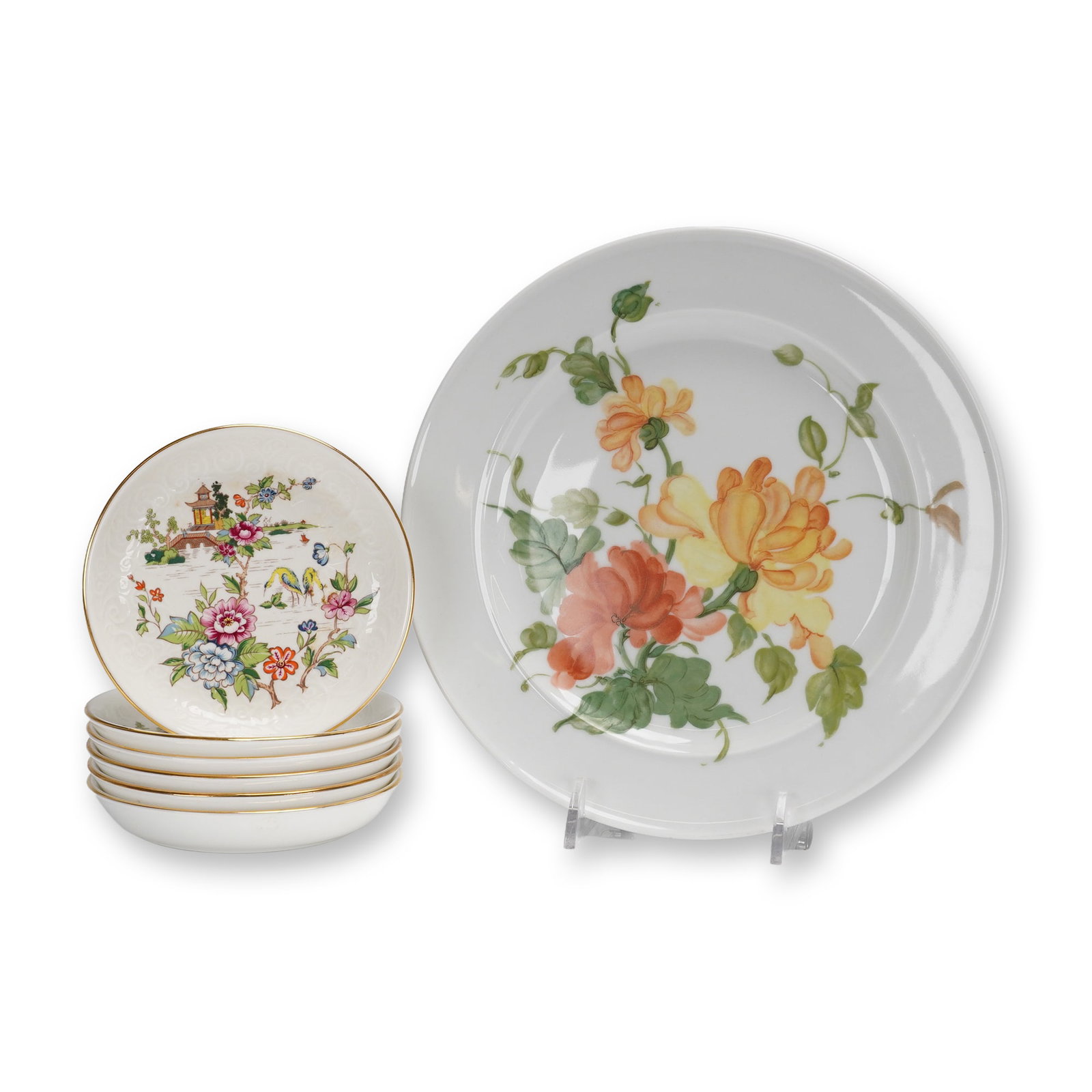 Coll. of 7 Kaiser Lauriane & Crown Staffordshire Pagoda Plates & Saucers: A collection of 7 pieces of porcelain tableware, representing two distinct manufacturers and patterns. The lot includes one large display plate by Kaiser and six small saucers by Crown Staffordshire.