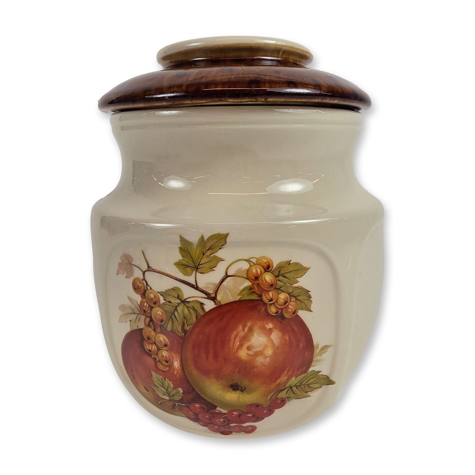 McCoy Fruit Festival Ceramic Canister Jar: The cream-colored high-gloss body features a transfer-printed fruit motif with apples and currant bunches. The lid is finished in a contrasting dark brown mottled drip glaze. Base is marked with the