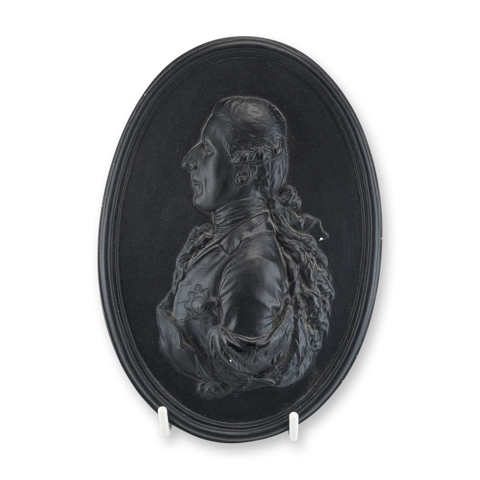 English Black Basalt Oval Portrait Medallion Plaque of a Gentleman: This oval portrait medallion plaque is produced in black basalt stoneware, featuring a high-relief profile portrait of an 18th-century gentleman in the style of contemporary English potteries such as