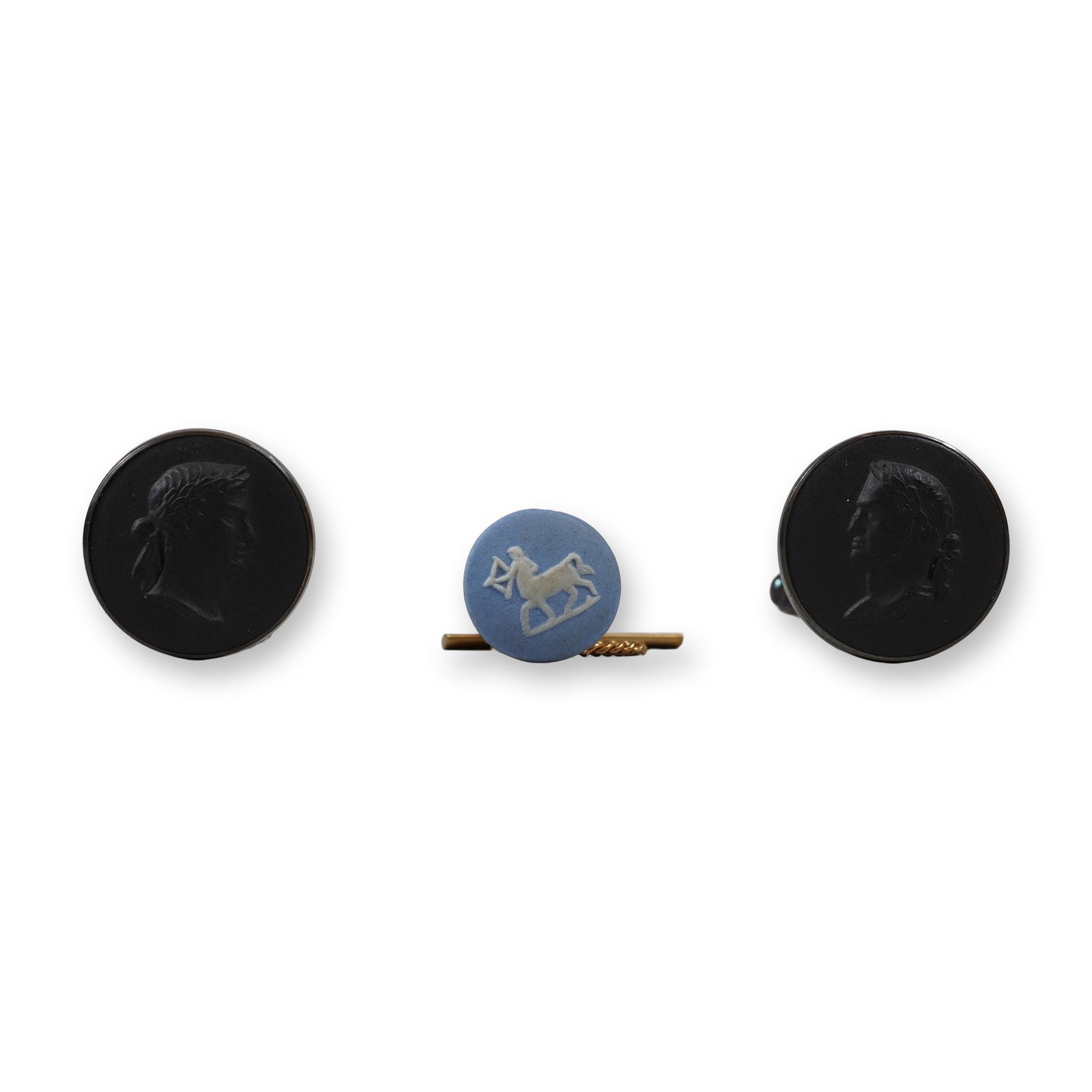 3pc Wedgwood Black Basalt and Blue Jasperware Jewelry Set Including Cufflinks and Pin: This three-piece set of Wedgwood gentleman's jewelry consists of a pair of cufflinks and a single tie tac or lapel pin. The cufflinks feature round black basalt stoneware cameos with a classical male
