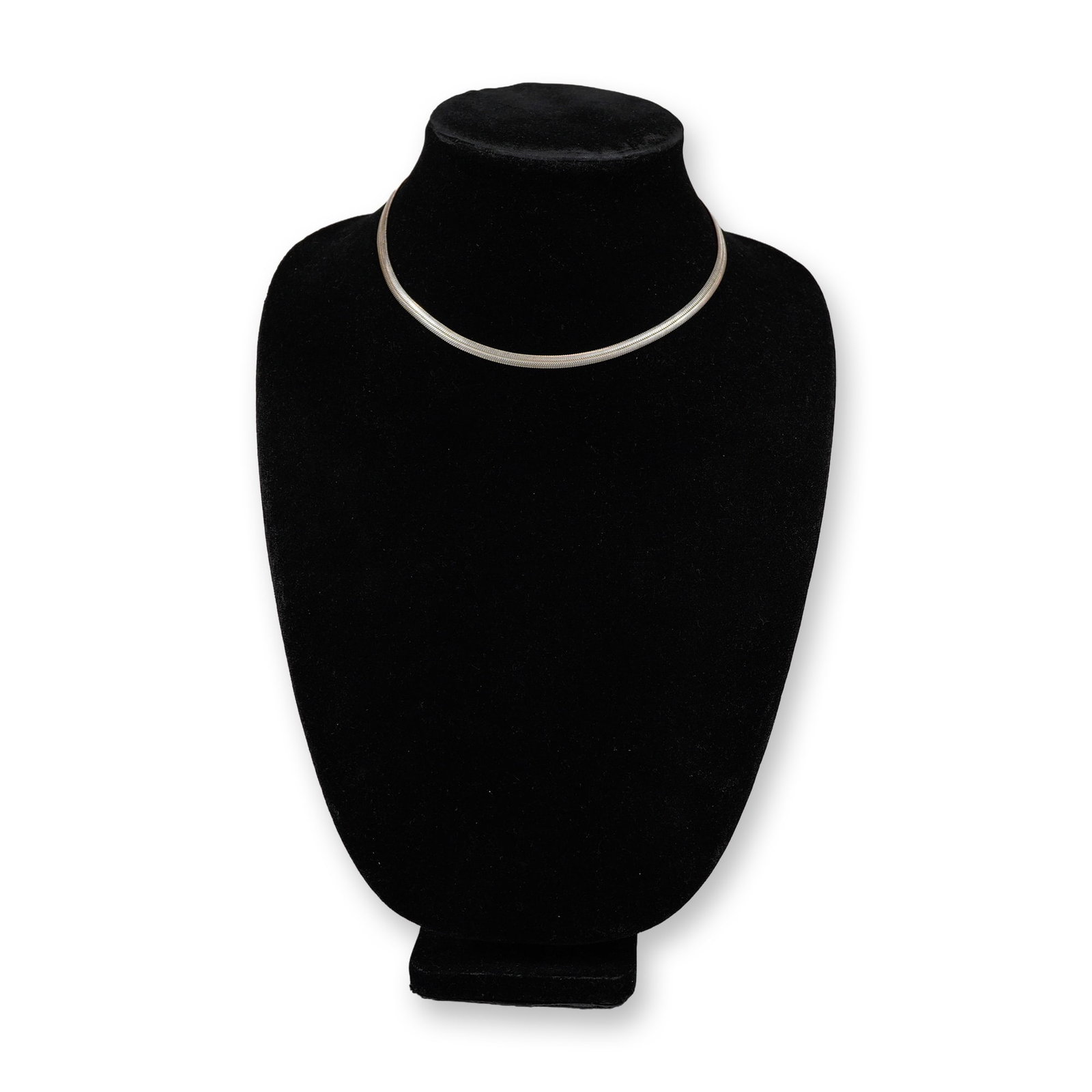 Italian Sterling Silver 925 Herringbone Chain Necklace: An Italian sterling silver necklace featuring a flat herringbone chain weave. The necklace is composed of flexible, interlocking V-shaped links that create a smooth, reflective surface. The piece is
