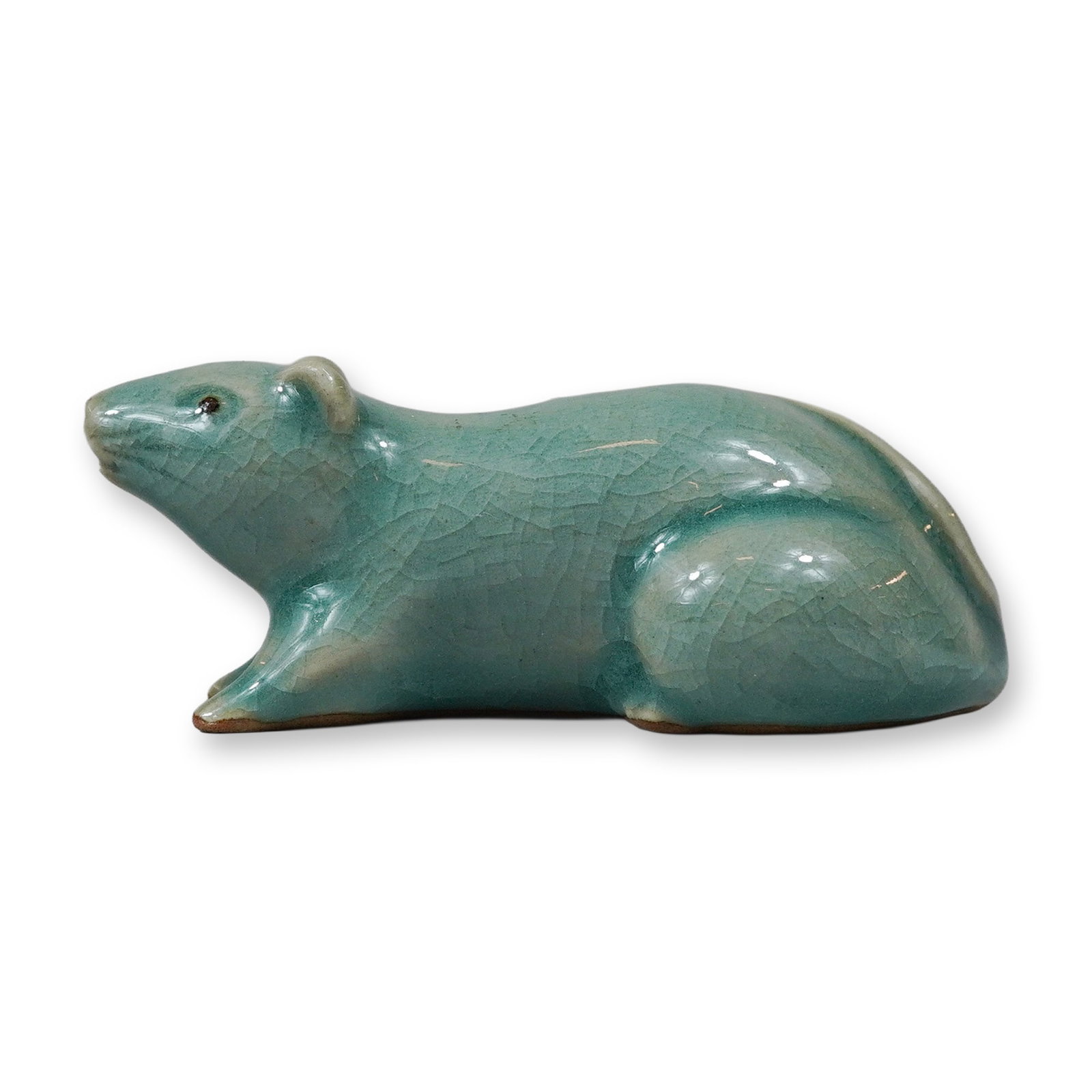 Japanese Celadon Glazed Ceramic Rat Water Dropper: This Japanese ceramic water dropper, known as a suiteki, is modeled in the form of a crouching zodiac rat. The piece is constructed of a light-colored ceramic body and finished with a pale sea-foam