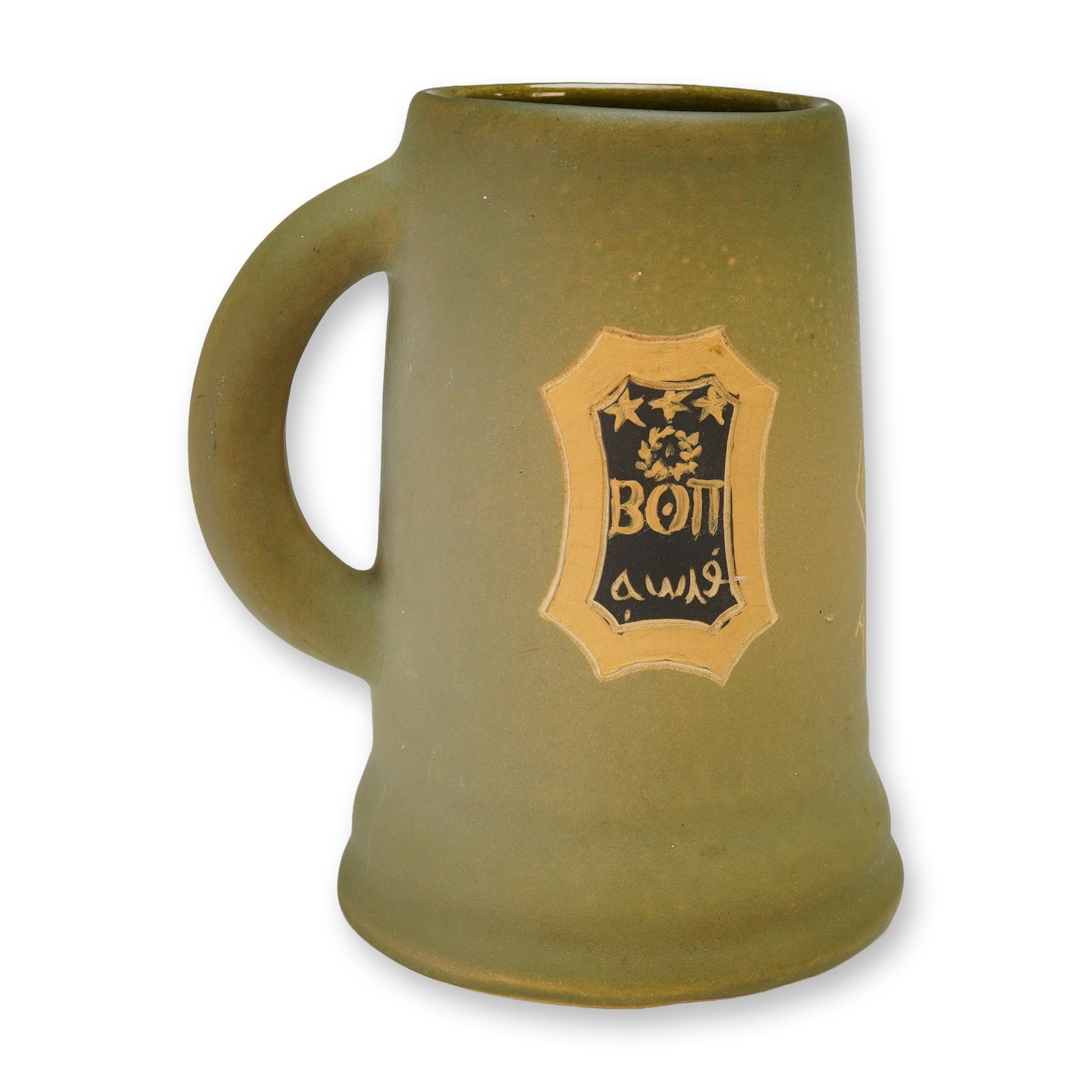 Weller Pottery Dickenware Mug: Weller Pottery featuring a matte green glaze. The vessel is decorated with enameled motifs on opposing sides. One side displays the crest for the Beta Theta Pi fraternity, consisting of a black shield