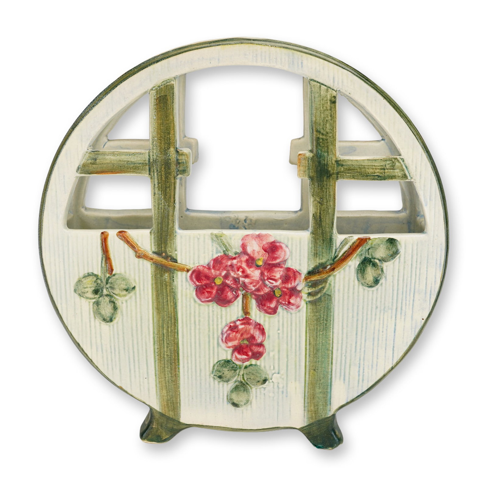 Weller Pottery Klyro Basket Vase: A Weller Pottery Klyro basket vase of circular moon-gate form. This ceramic vessel features an openwork trellis upper section and a lower body decorated with molded relief pink blossoms on a branching