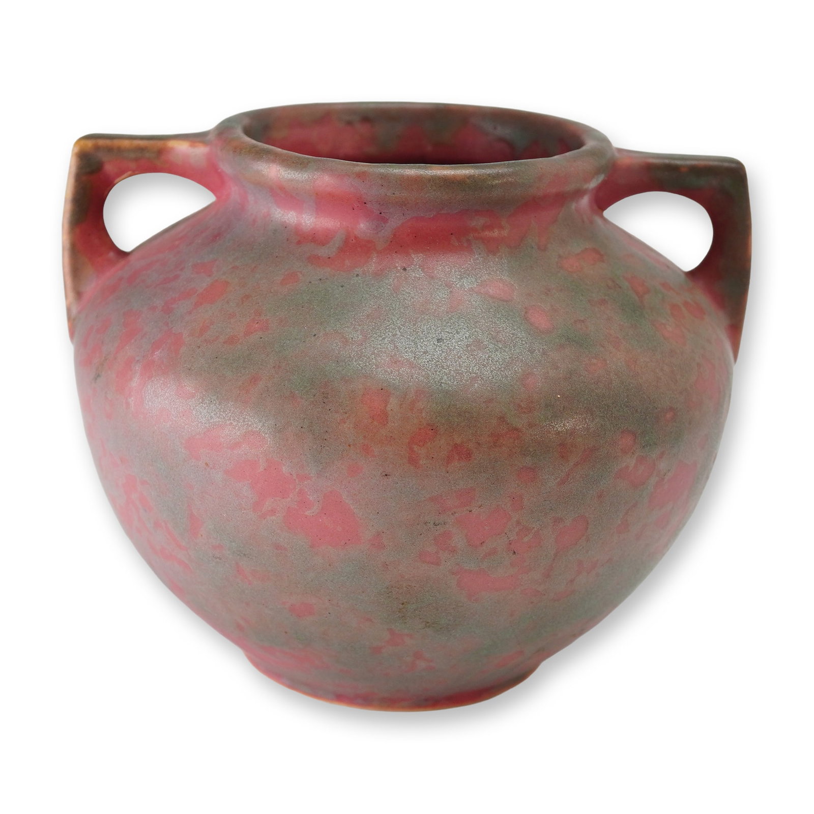Weller Pottery Two Handled Vase, Carnelian II: This vessel belongs to the Carnelian II line, introduced circa 1926, and is finished in the desirable mottled matte glaze often referred to as Red or Cotton Candy. The bulbous ceramic body features a 