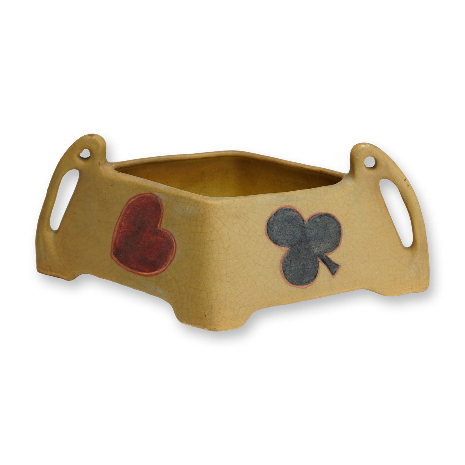 Rare Weller Art Pottery Lozenge Form Planter: The vessel is finished in a matte buff-colored glaze and features four integral feet. Two large, arched, open-work handles extend from the opposite acute corners, lending the piece an architectural si