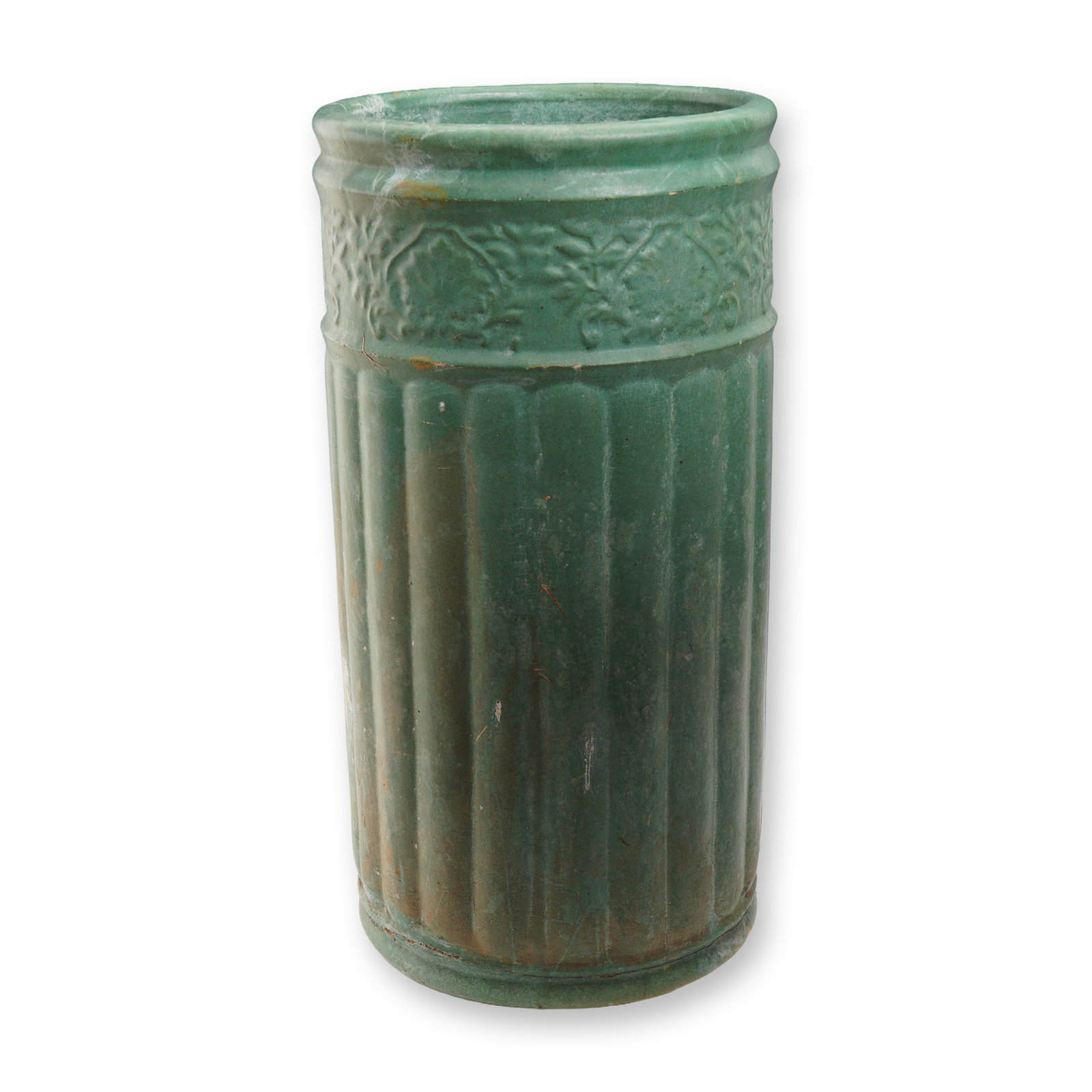 Weller Pottery Matte Green Umbrella Stand: A substantial Weller Pottery umbrella stand in a matte green glaze. The cylindrical form features vertical ribbing along the body, with a band of embossed floral and vine decoration encircling the top
