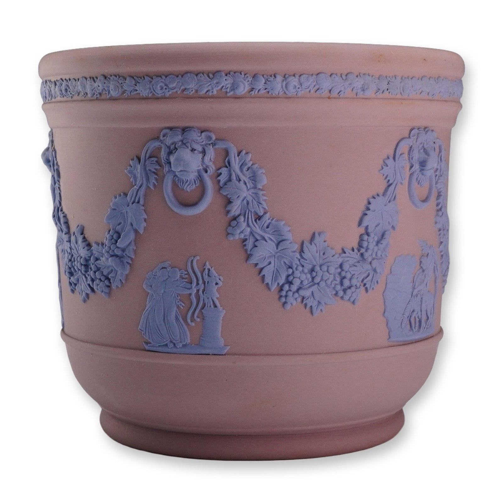 Wedgwood Mauve and Blue Jasperware Cachepot: A Wedgwood jasperware cachepot featuring a mauve or lilac stoneware body with pale blue applied relief decoration. The cylindrical vessel is designed in the Neoclassical style with a molded rim and
