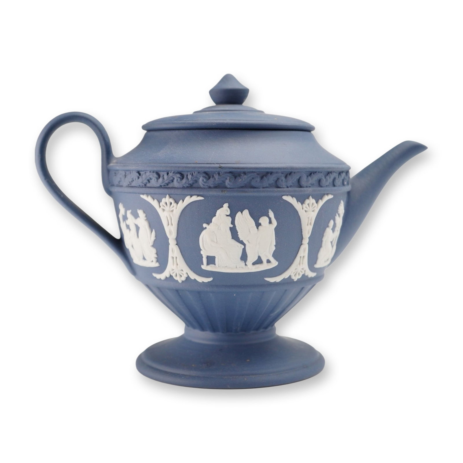Wedgwood Portland Blue Jasperware Lidded Teapot: Wedgwood Portland Blue jasperware lidded teapot. This neoclassical stoneware vessel features a globular body mounted on a circular pedestal foot, a curved spout, and a C-shaped handle. The body is dec