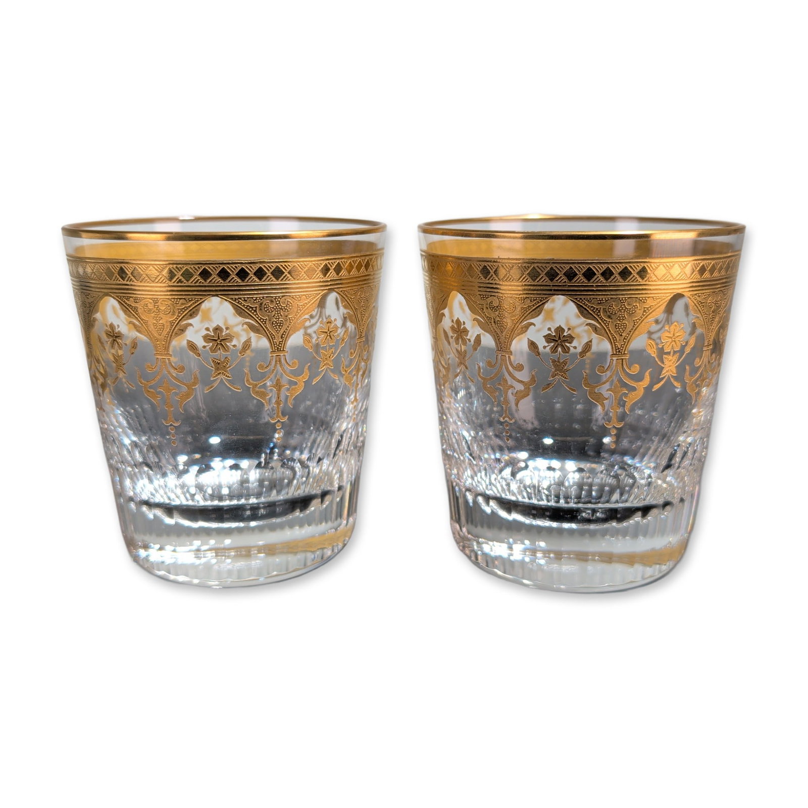 2pc Baccarat France Prestige Gold Encrusted Crystal Tumblers: Baccarat, France, pair of rocks glasses in lead crystal from the Prestige pattern, featuring acid-etched and gold-encrusted decorative borders. Each vessel is decorated with a gilt rim of diamond latt