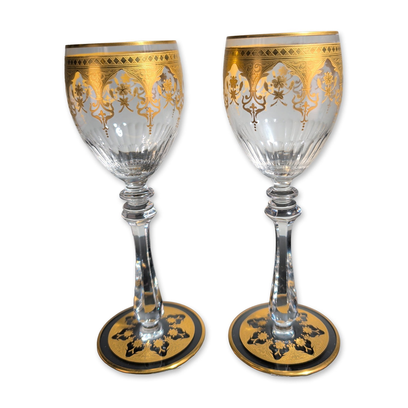 2pc Baccarat France Prestige Gold Encrusted Crystal Wine Glasses: Baccarat, France, pair of Prestige pattern wine glasses in clear lead crystal, featuring gold-encrusted bands at the rims with scrolling foliate and floral motifs. Lower bowls with vertical fluted cut