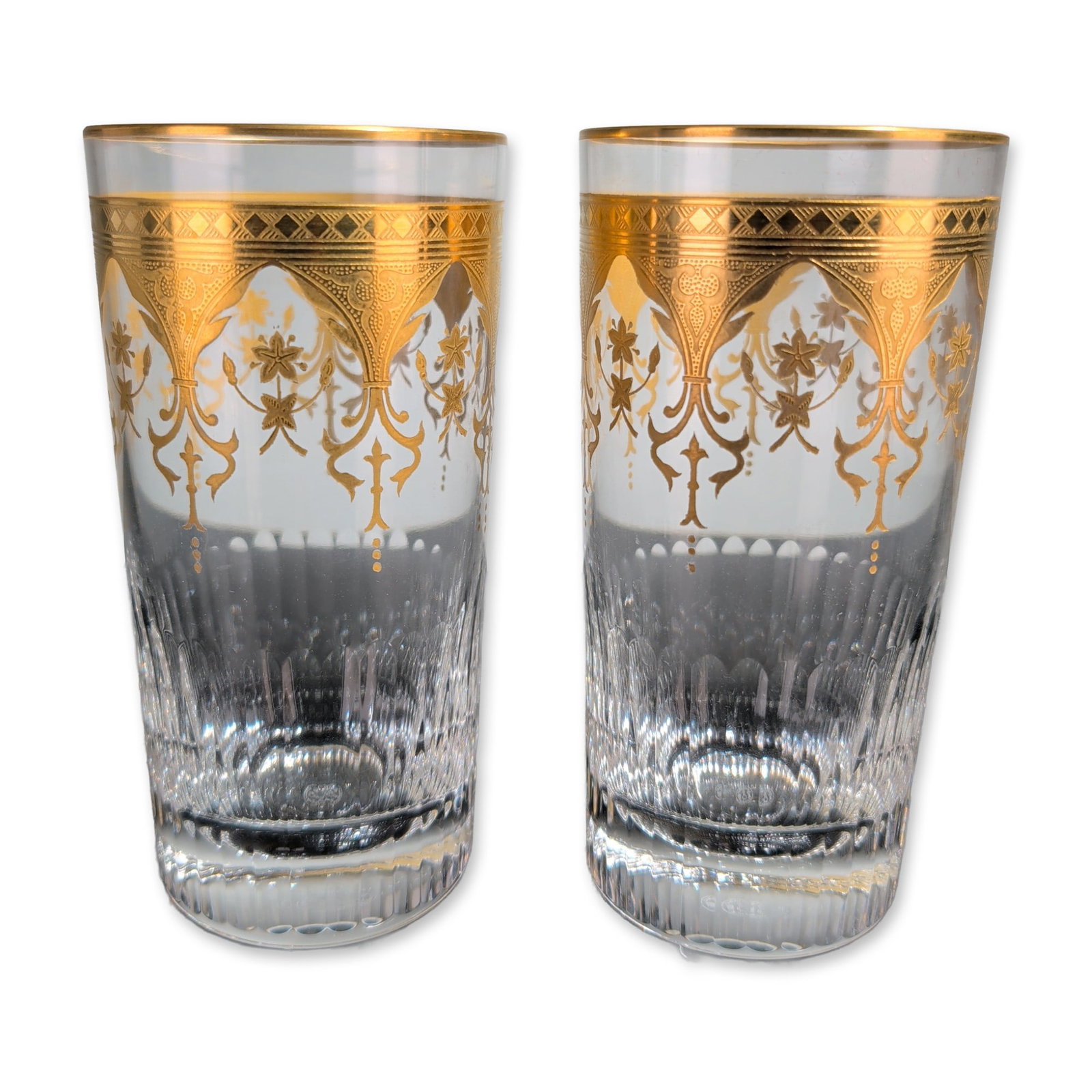 2pc Baccarat France Prestige Gold Encrusted Highball Glasses: Baccarat, France, pair of lead crystal highball glasses in the Prestige pattern, featuring gold encrusted acid-etched borders decorated with neo-classical foliate scrolls, floral sprigs, and fleur-de-