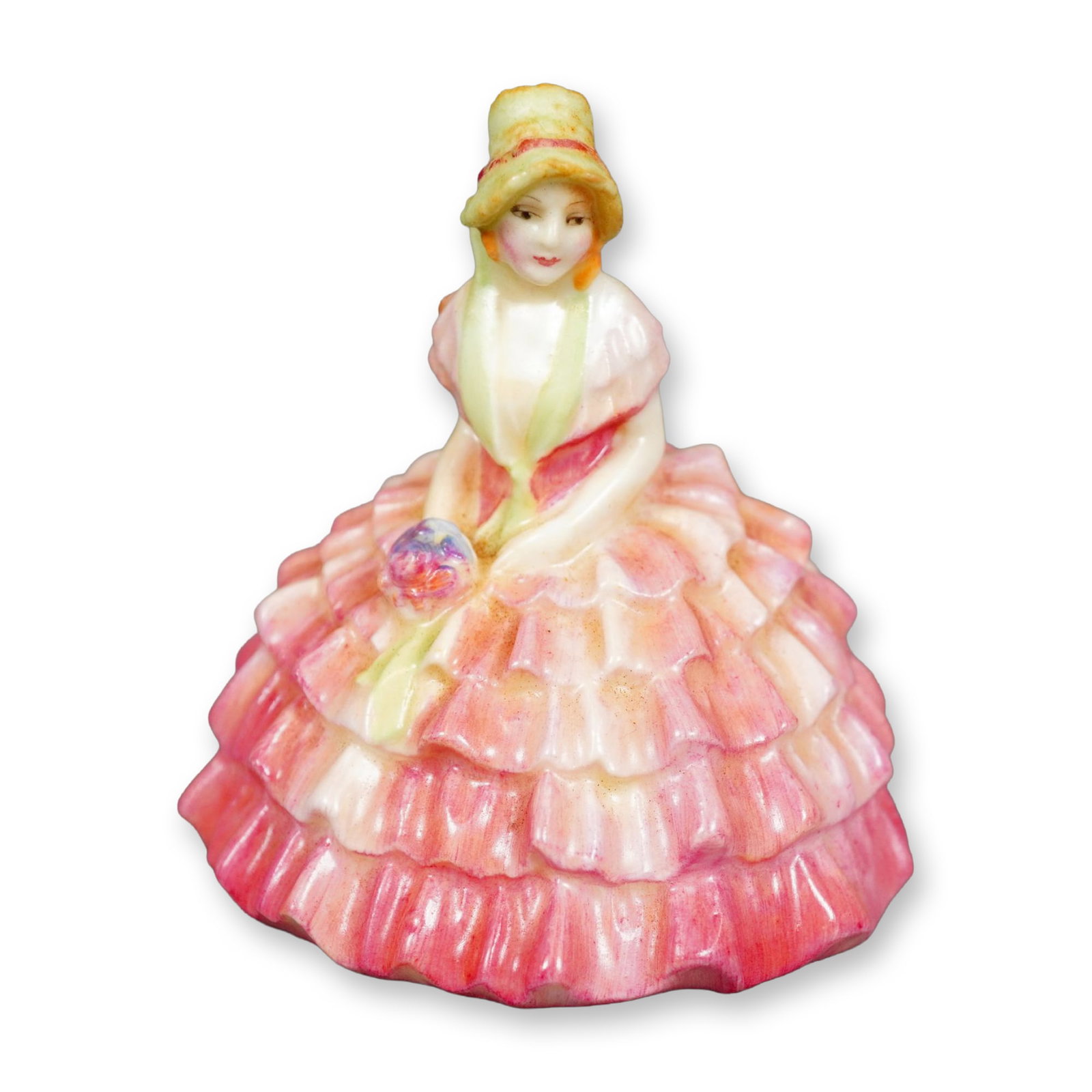 Royal Doulton Figurine, Chloe M9: Hand painted figure of a young woman seated. She is wearing a pink ruffled gown and a light-green hat. Royal Doulton backstamp. Dimensions: 2.75"L x 2"W x 2.75"H Manufacturer or Brand: Royal Doulton C