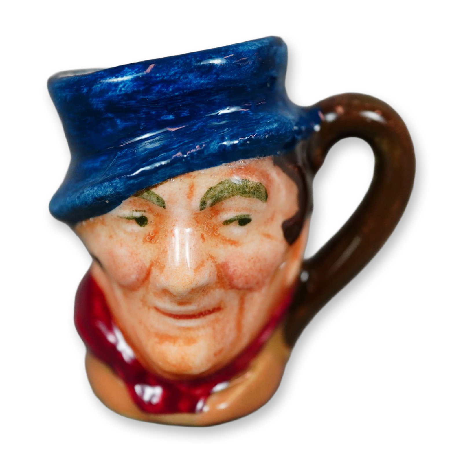 Royal Doulton Colorway Tiny Dickens Character Jug, Sam Weller D6147: Character jug modeled after Sam Weller, a fictional character from The Pickwick Papers (1836"1837), the first novel by Charles Dickens. Depicted wearing a blue hat and burgundy scarf, with a plain bro
