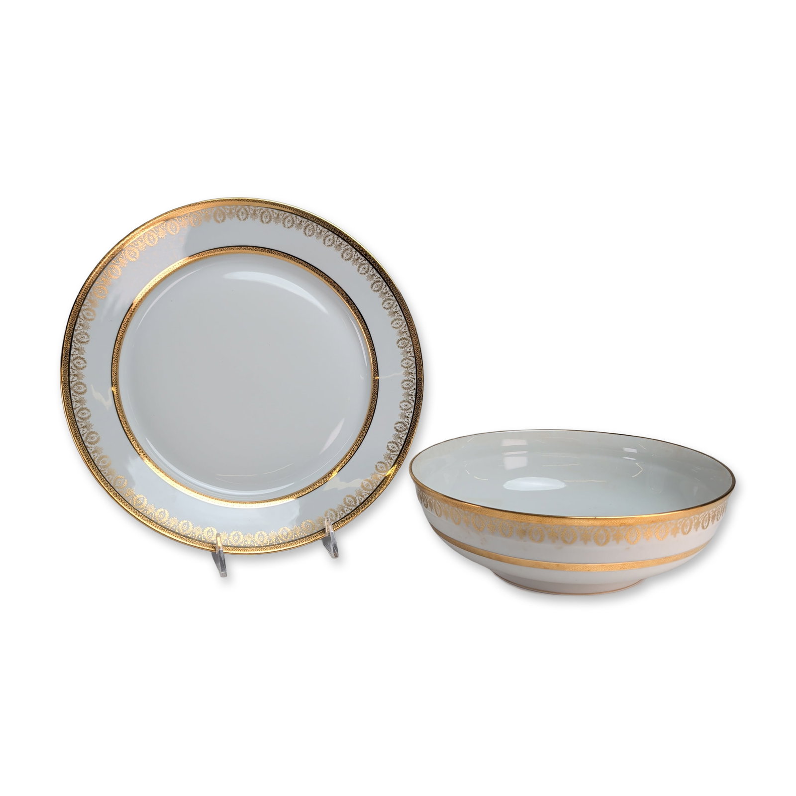 2pc Charles Field Haviland Limoges Gilded Porcelain Serving Platter and Fruit Bowl: Charles Field Haviland, Limoges, France, two pieces serving plate and deep bowl in white hard-paste porcelain, decorated with wide acid-etched gold bands in the Arizona pattern, featuring foliate scro