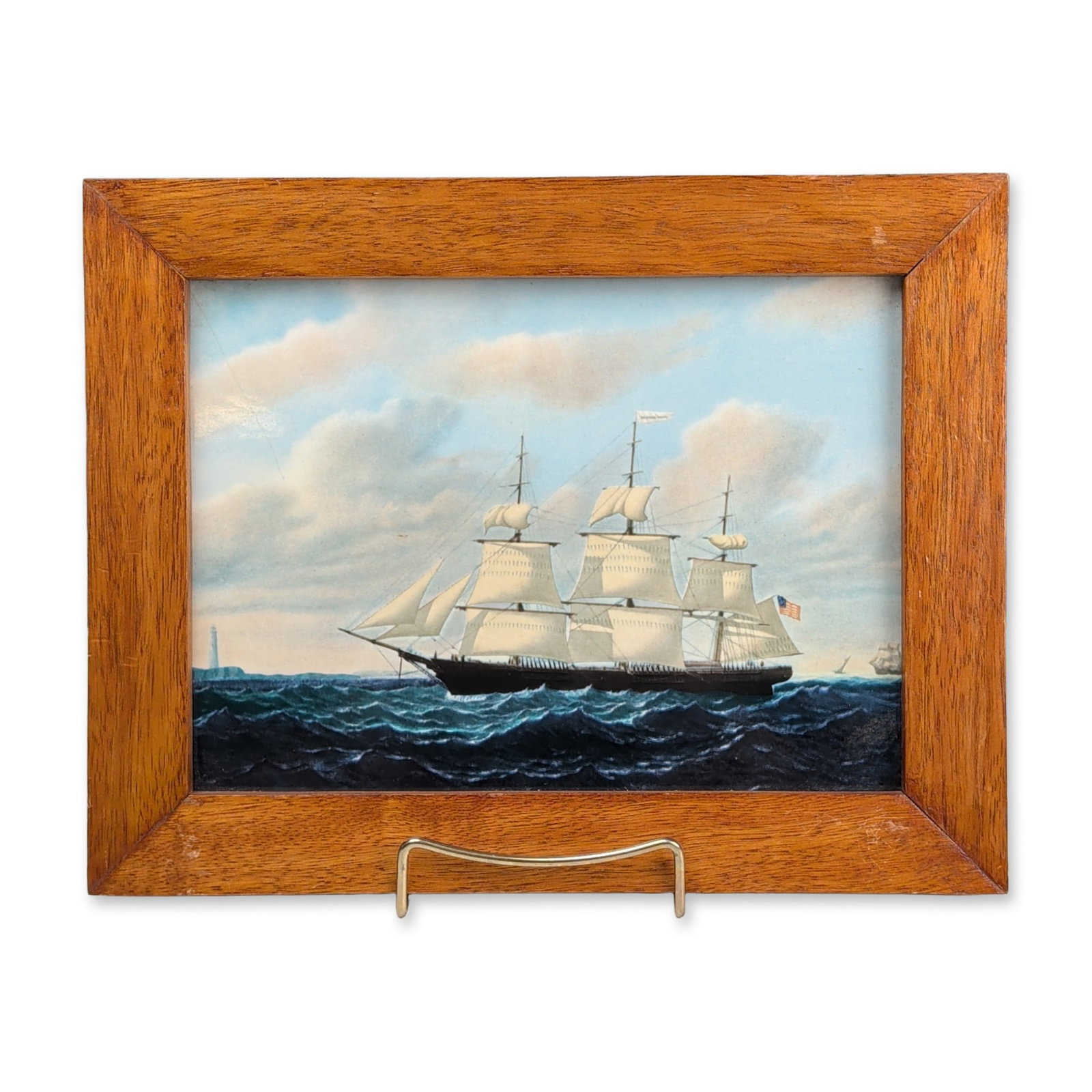 Wedgwood of Etruria & Barlaston Framed Porcelain Nautical Tile, Dashing Wave: Wedgwood ceramic plaque featuring a polychrome transfer-printed depiction of the American clipper ship Dashing Wave. The composition is reproduced from an original marine painting by William Bradford.
