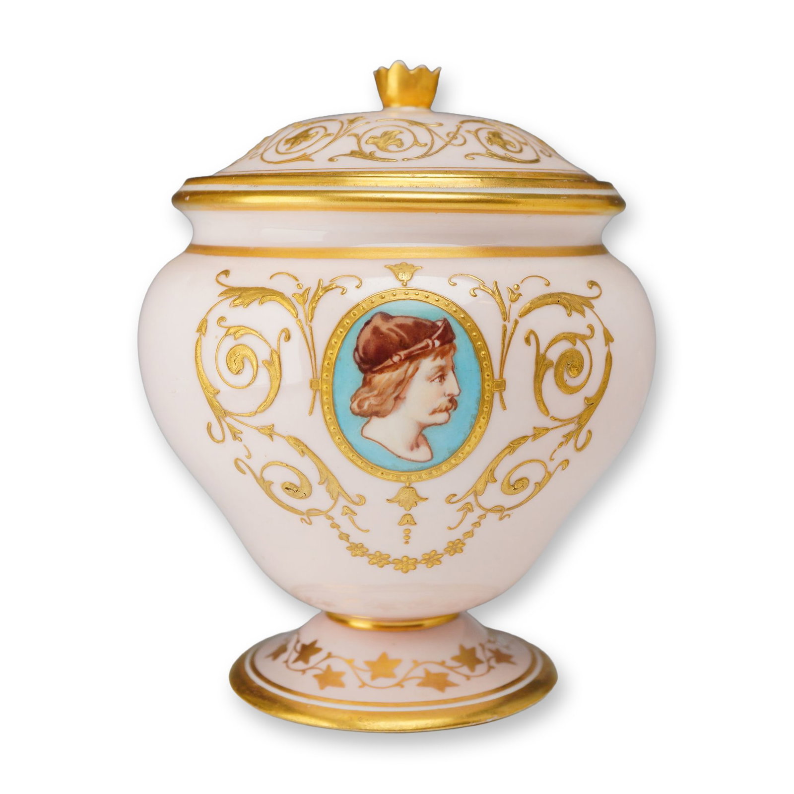 Wedgwood Porcelain Lidded Urn with Gilt and Portrait Medallion: This porcelain lidded urn or sugar tureen features a peach-colored ground and is stamped Wedgwood. The vessel is constructed in an ovoid form on a pedestal foot with a domed lid topped by a gilded cro