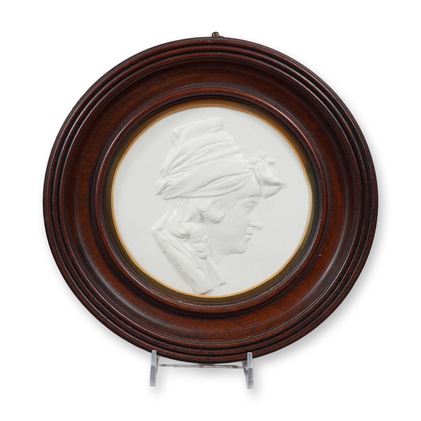 Wedgwood Ceramic Profile Relief Plaque of Mrs. Flaxman: This circular Wedgwood creamware ceramic relief plaque depicts a profile portrait of Ann Flaxman, wife of the sculptor John Flaxman. The subject is portrayed facing right, wearing a ruffled collar and