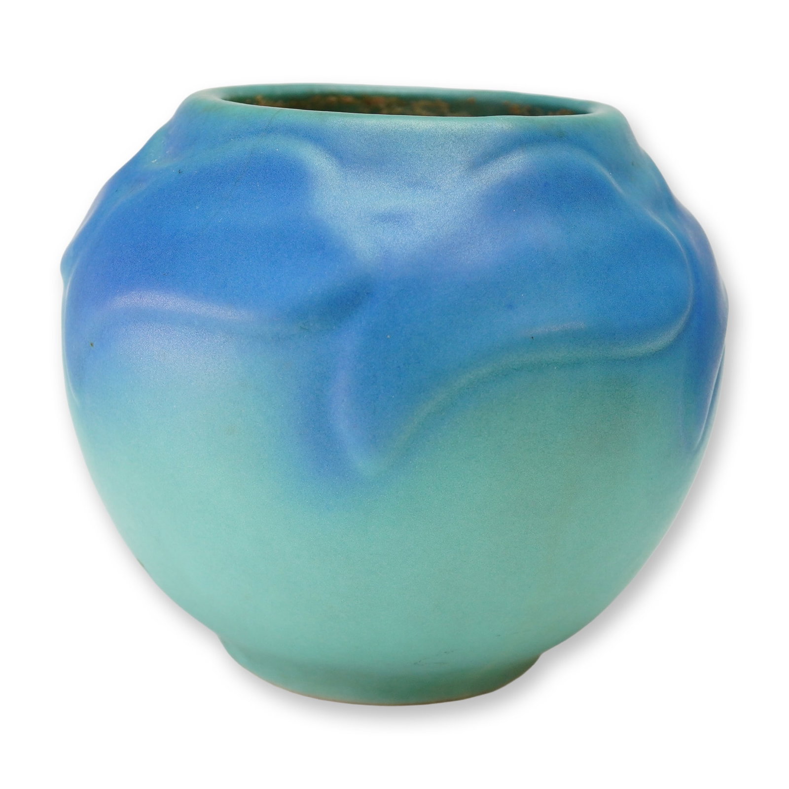 Van Briggle Art Pottery Matte Two-toned Glazed Vase: The ceramic body displays a medium blue upper section that transitions into a pale turquoise green lower portion. The transition is defined by a stylized, low-relief foliate or wave-like design encirc