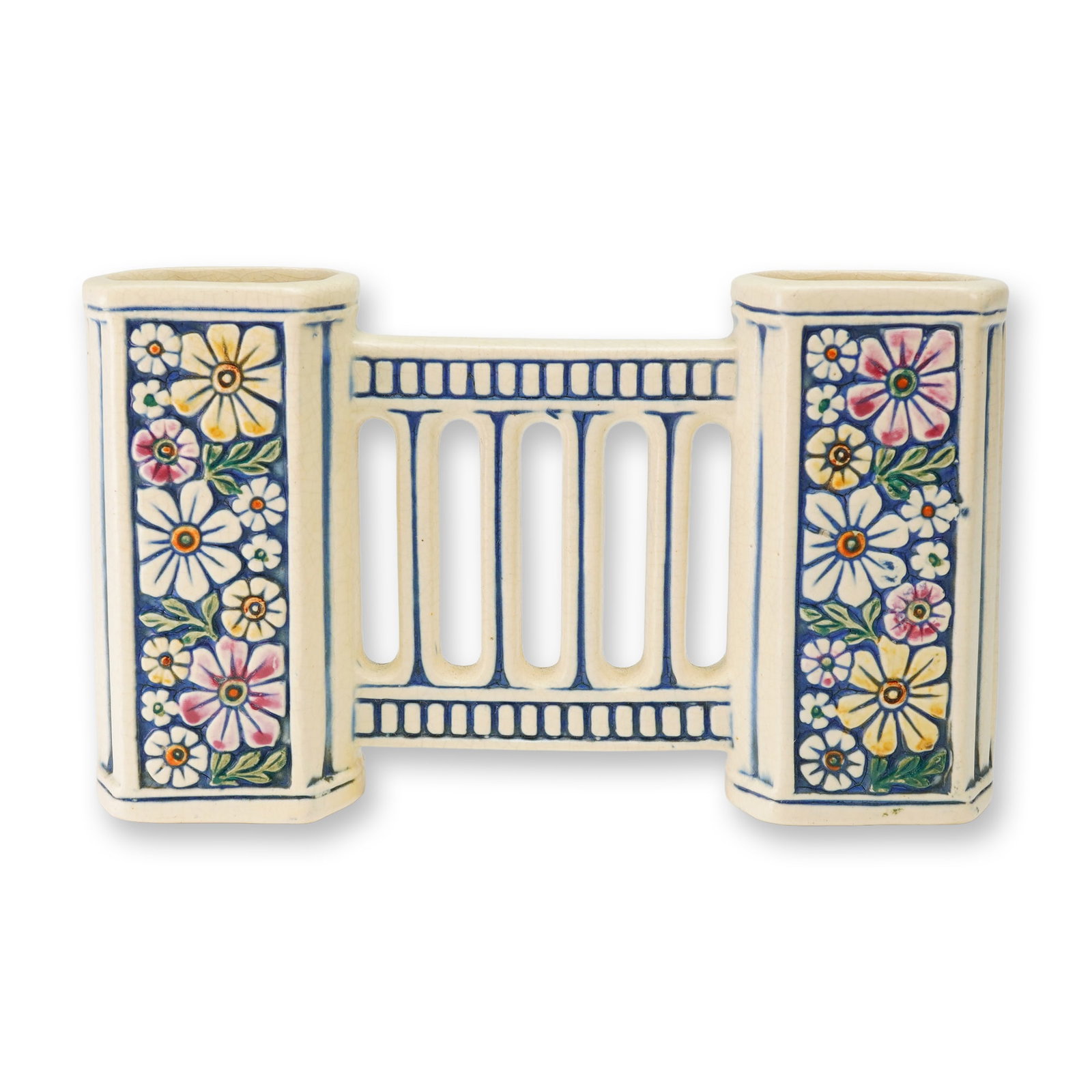 Weller Pottery Bridge Vase, Florala: A Weller Florala art pottery bridge vase, produced circa 1915-1920. The ceramic vessel features two hexagonal-shaped reservoirs connected by a central openwork rail with five vertical slats. The piece