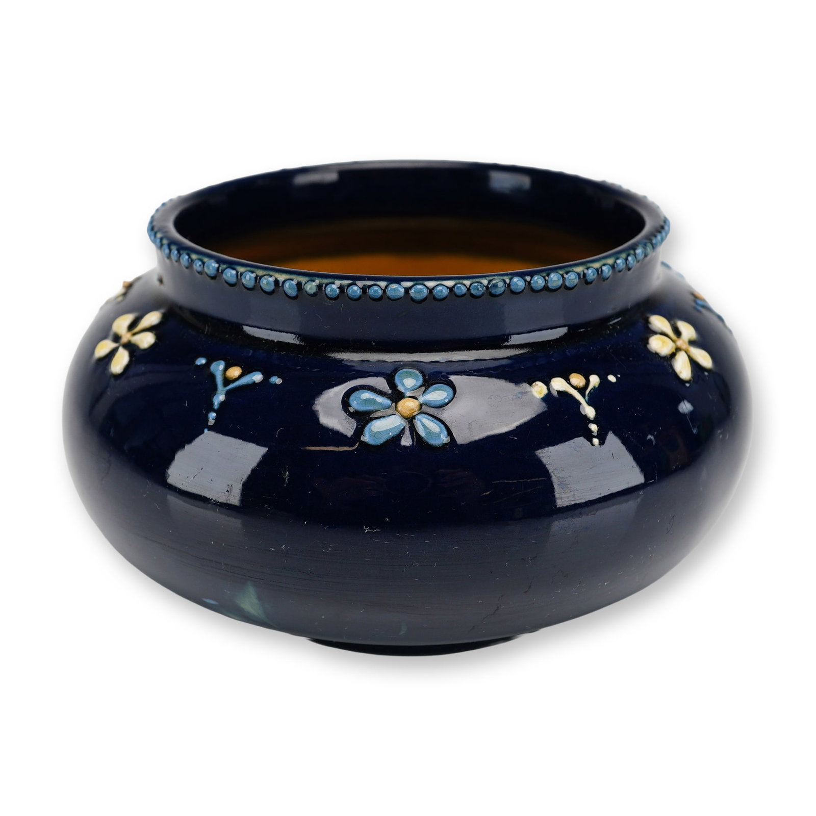 Weller Pottery Turada Vase: This piece features a squat, bulbous form characteristic of the Art Nouveau period, circa 1905. The exterior is finished in a deep, high-gloss cobalt blue glaze, embellished with hand-applied tube-lin