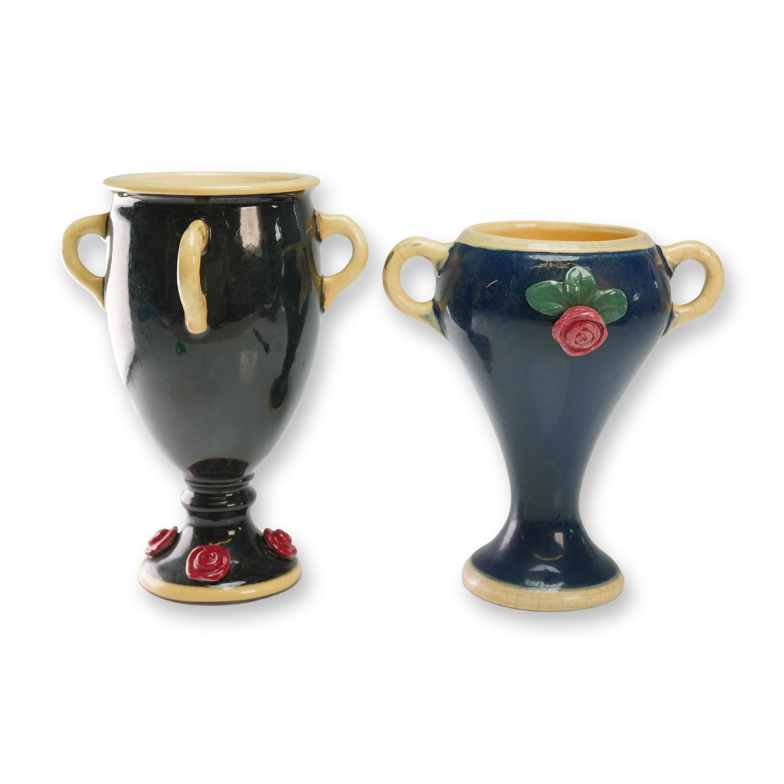 Two Weller Pottery Vases, Noval Rose: Both vessels feature a blue body with a cream-colored interior and accents on the rims, handles, and bases. The taller vase is designed with three loop handles and multiple pink rose accents in relief