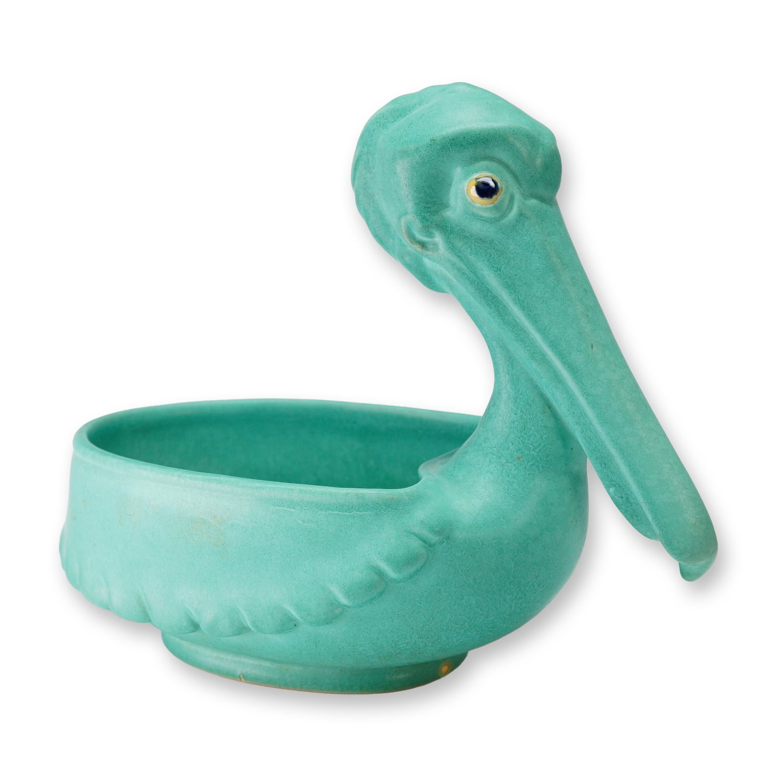 Weller Pottery Matte Turquoise Pelican Planter: A Weller Pottery ceramic figural planter designed in the form of a pelican, dating to approximately the 1930s. The piece is finished in a matte turquoise glaze. The stylized bird features an arched ne